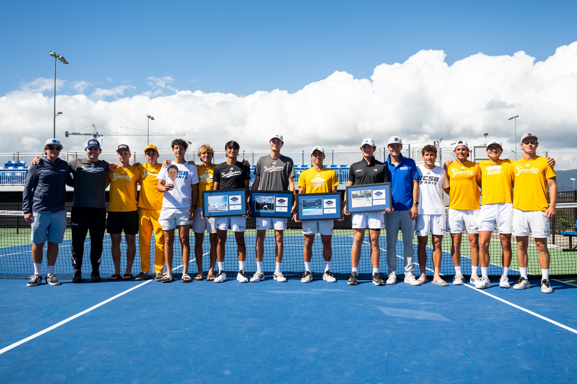 Men's Tennis celebrates their seniors and poses for a smile after their win against UC Irvine