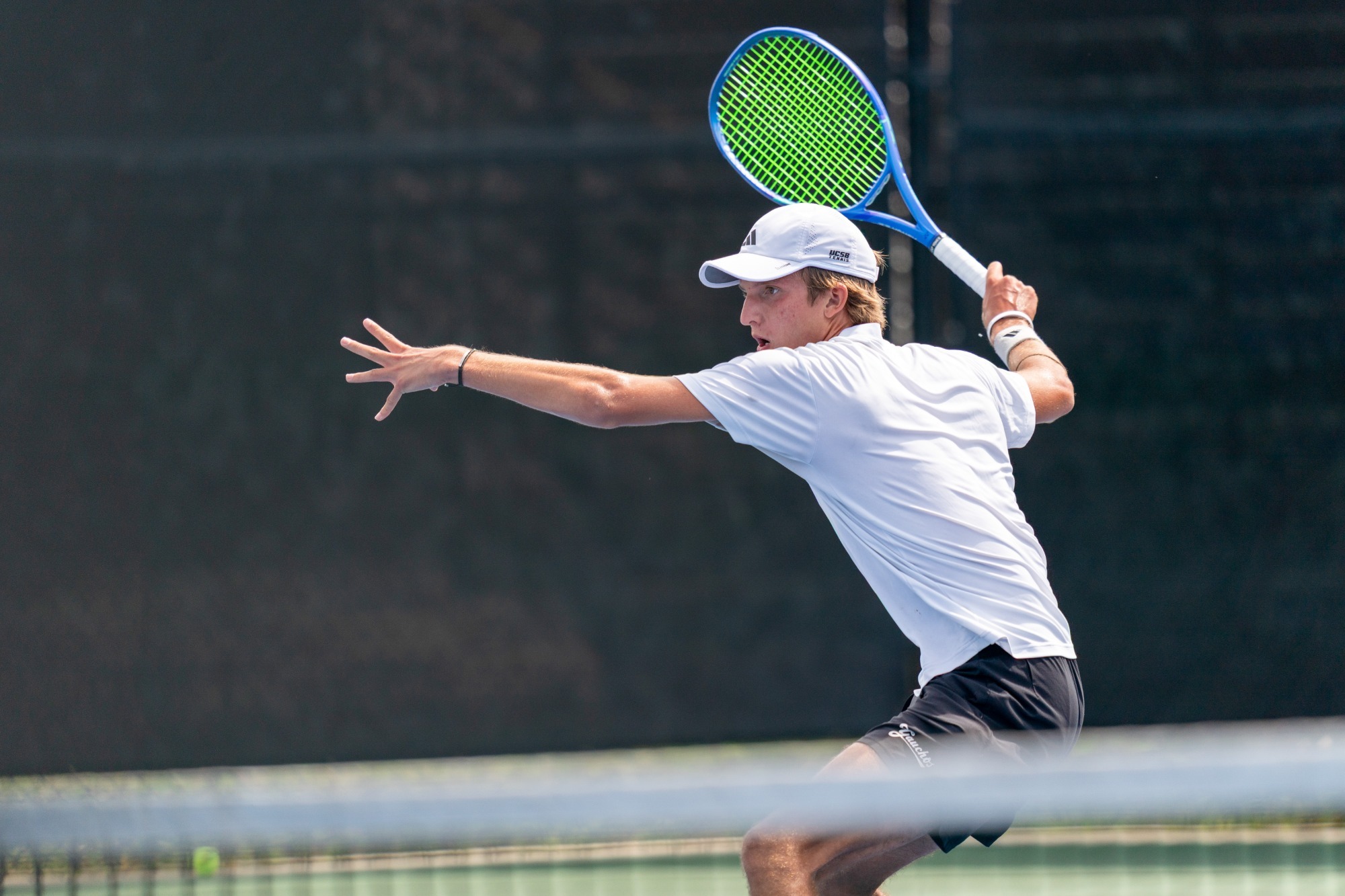 Matei Gavrea goes for a forehand vs UCSD