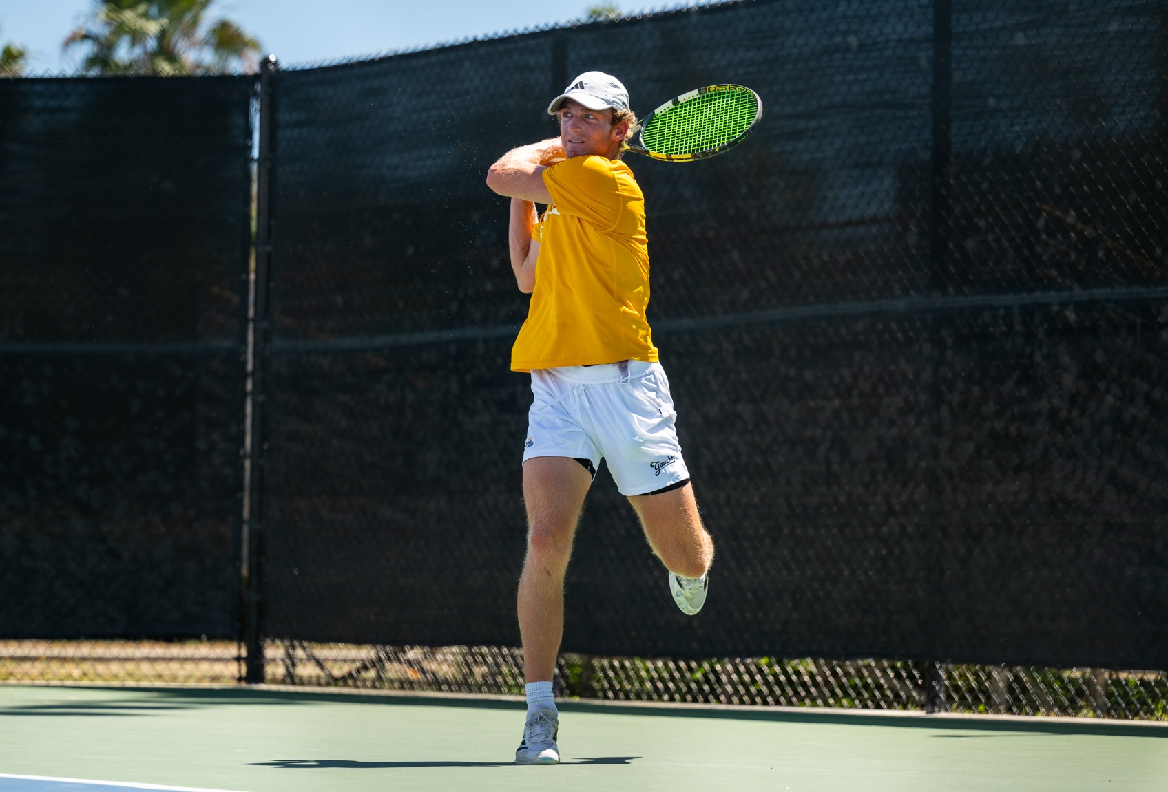 Conrad Brown hits a backhand vs UCI on Senior Day