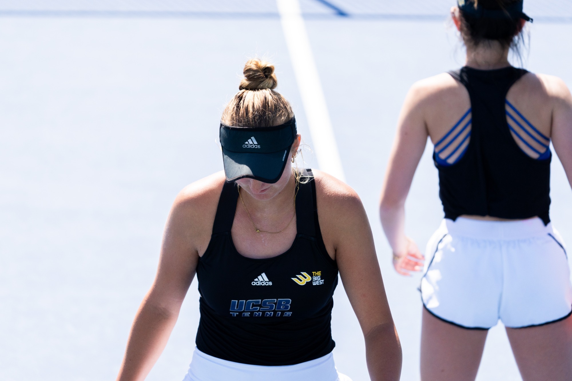 Lily Pradkin and My-Anh Holmes walk back to get ready for the next point