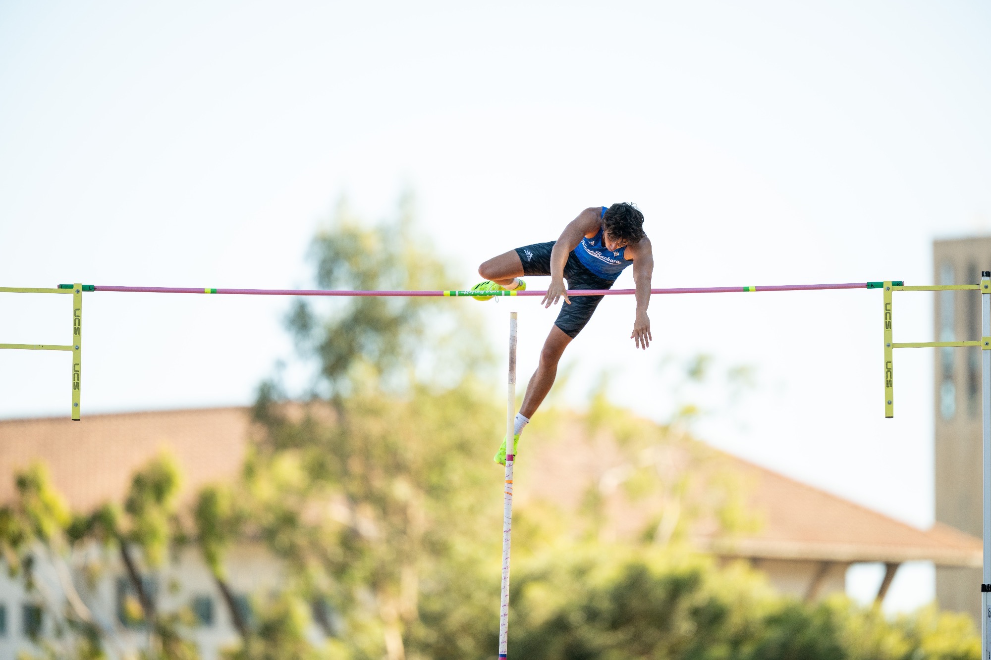 Ethan Nuttall pole vaults at Gaucho Relays