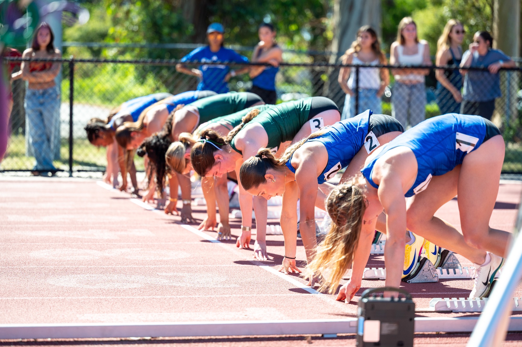 Gauchos at the line for the start of the 100m
