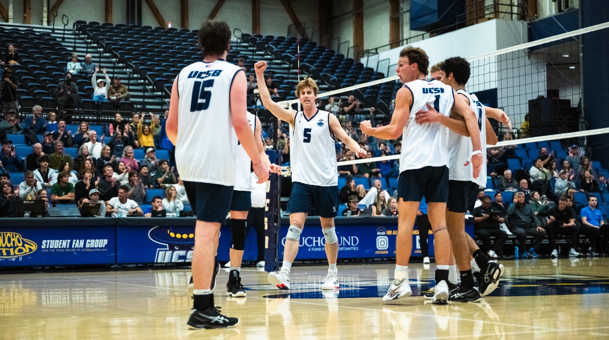 Georeg Bruening celebrates with Schobel and Guy after a point
