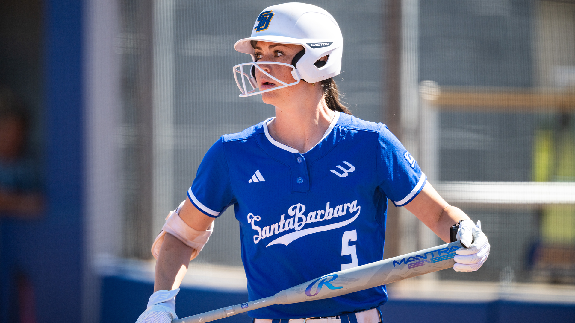 Danis Rauscher (#5) holds the bat at the knob and top of the bat prior to stepping in the box.