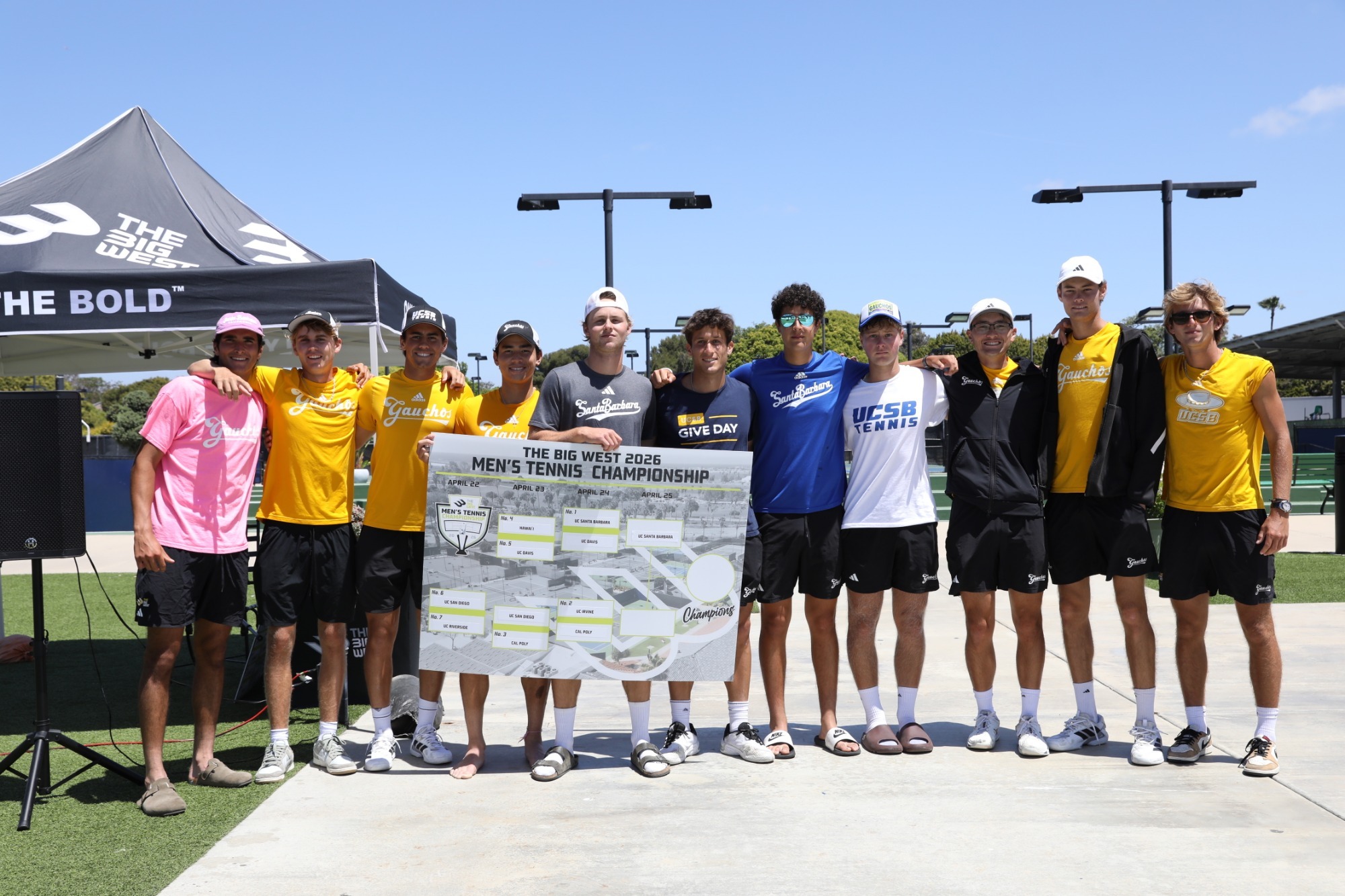 Men's Tennis poses with bracket poster board after advancing to Finals