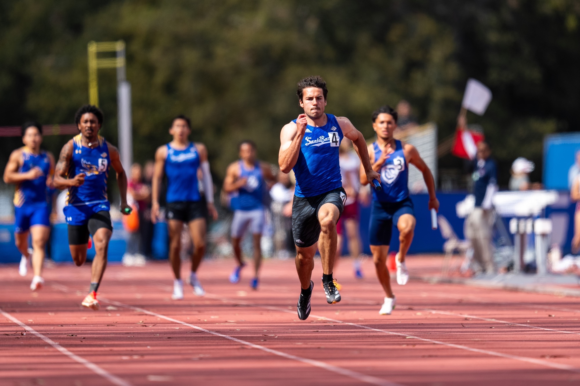 Matt Staples blazing to victory in the 4x100m replay