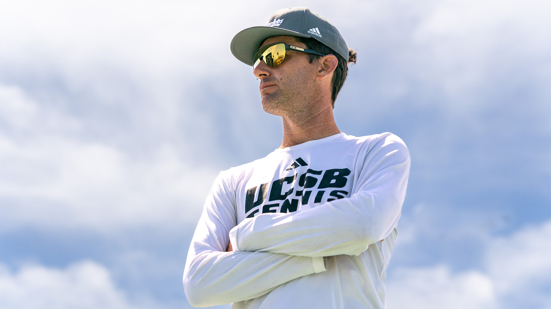 Blake Muller stands with aura with clouds converging behind him