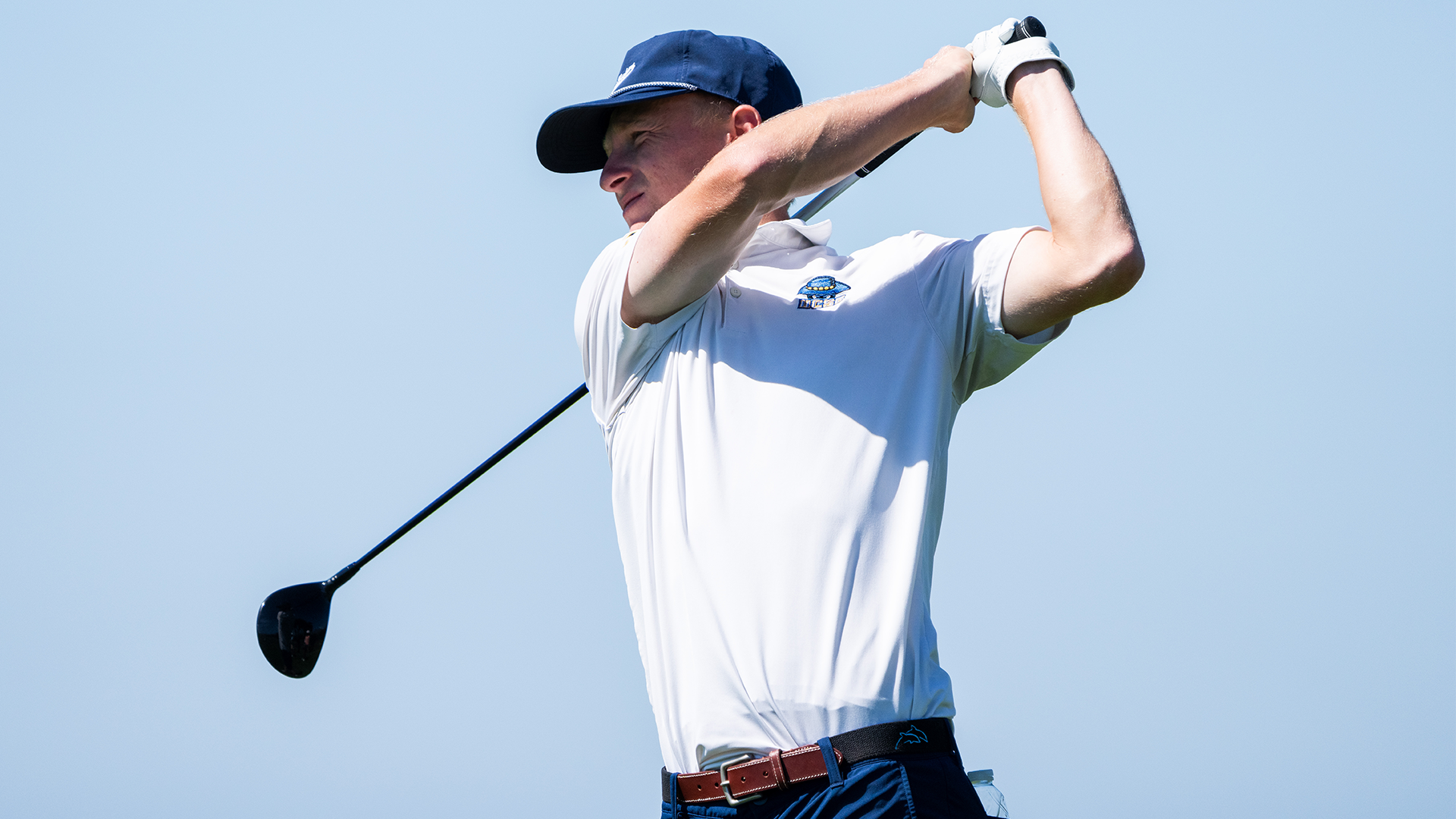 Ryan Gay finishes his tee shot swing at the Gaucho Invitational.