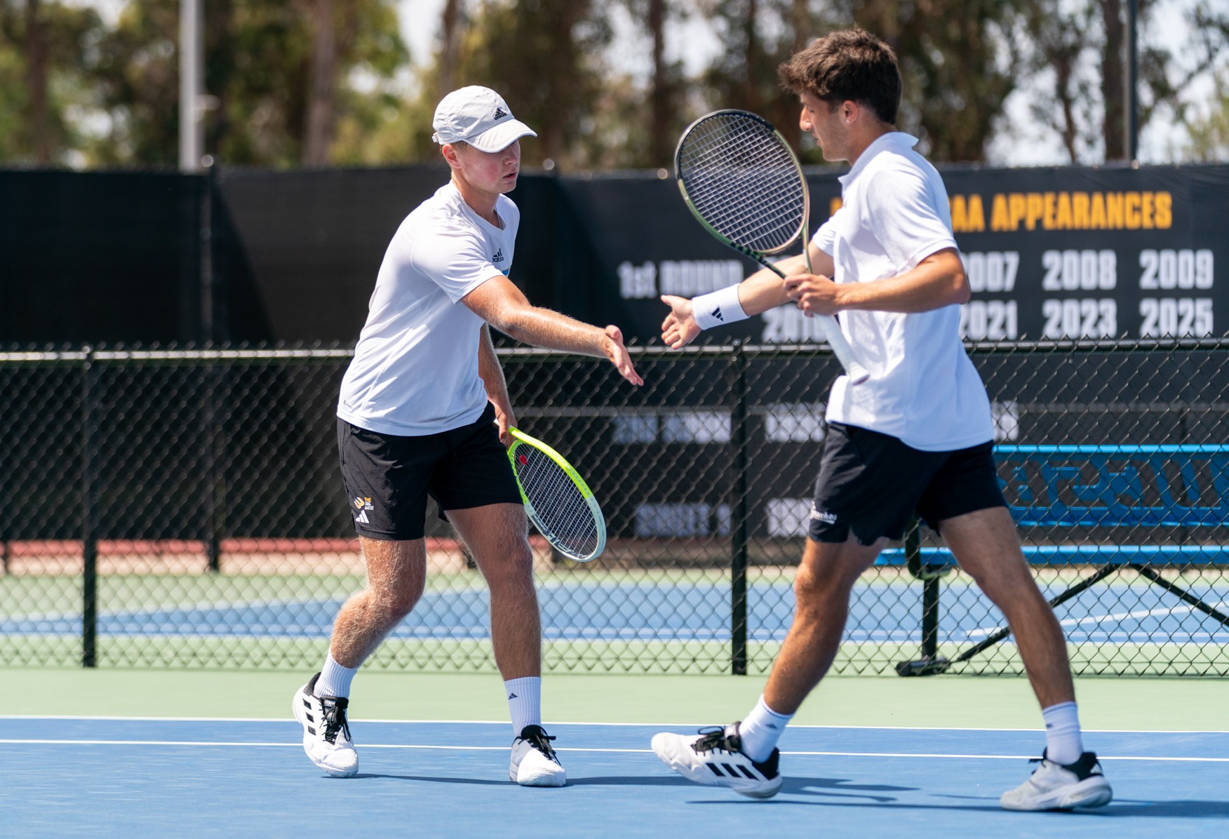 Karel Fromel and Miguel Avendano celebrate after a point vs UCSD