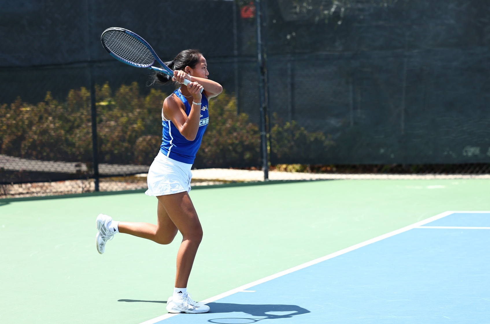 Isabella Wong hits a backhand