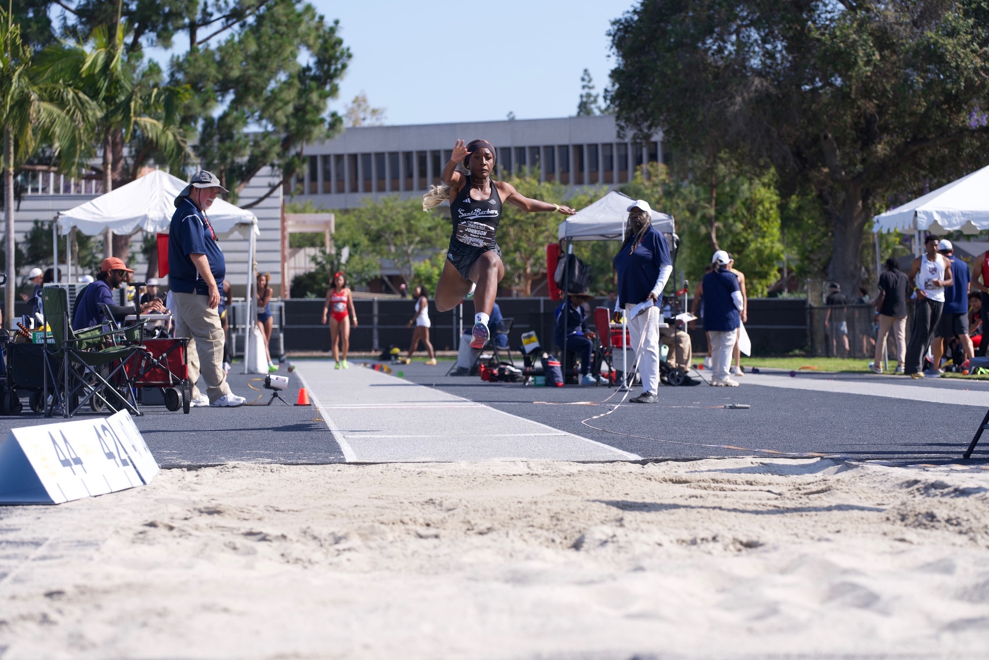 Kenni Johnson triple jumping at Big West Championships