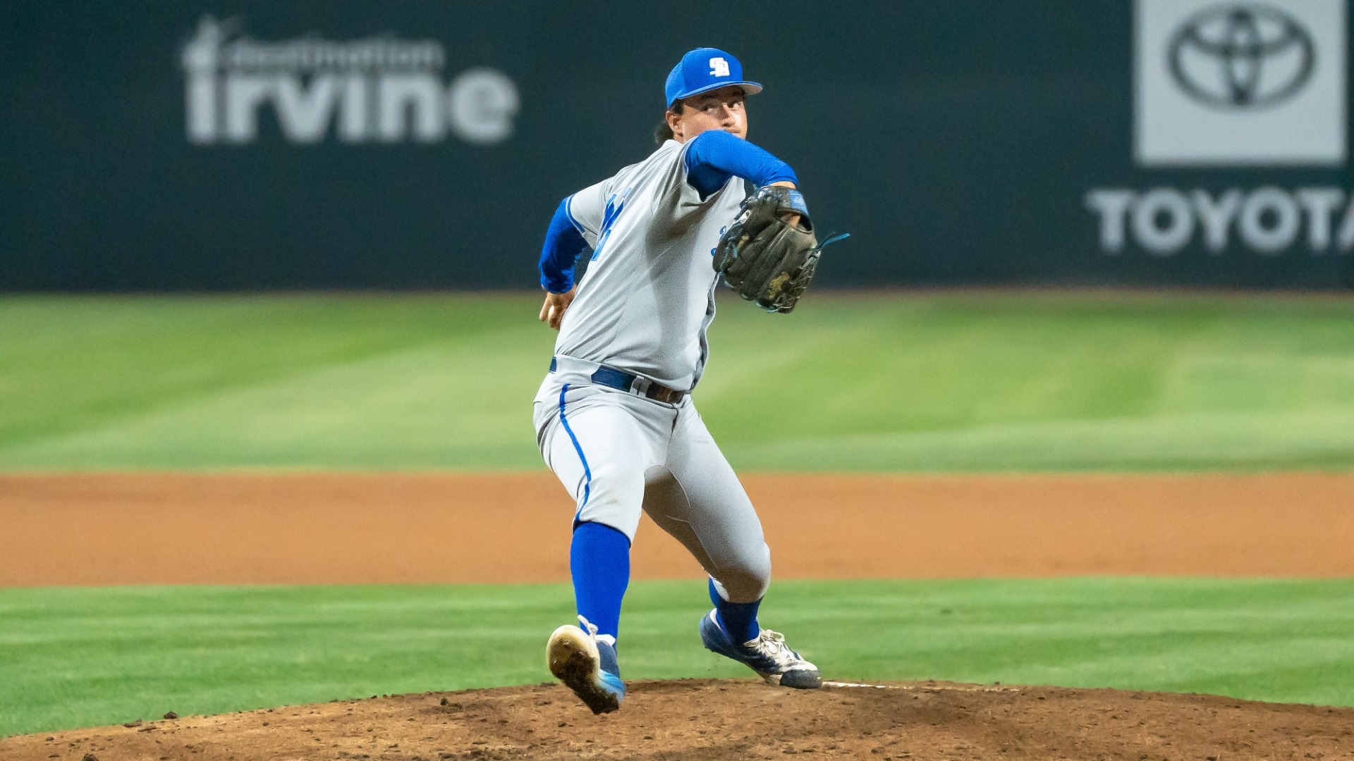 #22 Chase Hoover delivers a pitch under the lights at UC Irvine's Anteater Ballpark. 