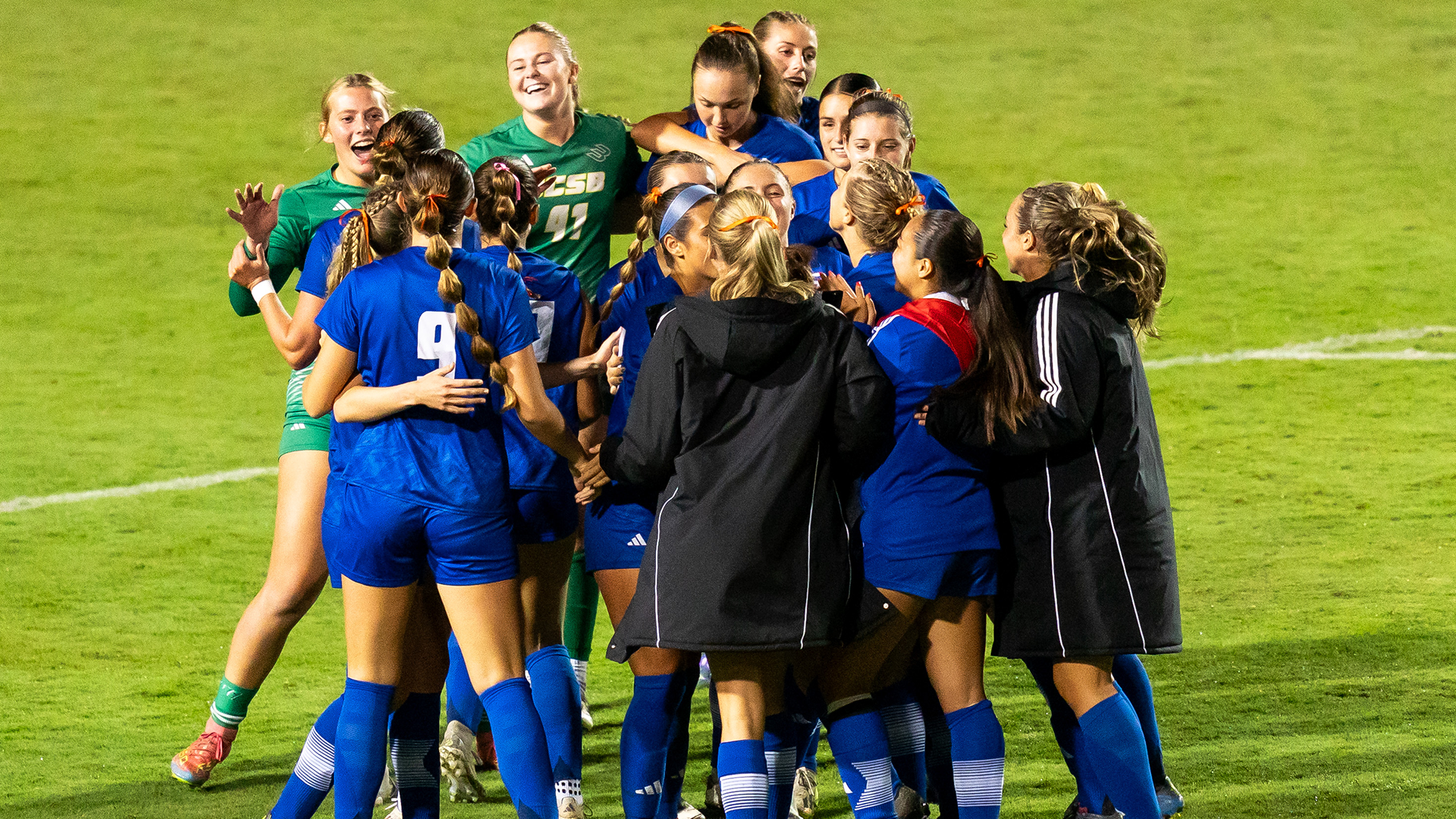 Women's Soccer Celebrating a win.