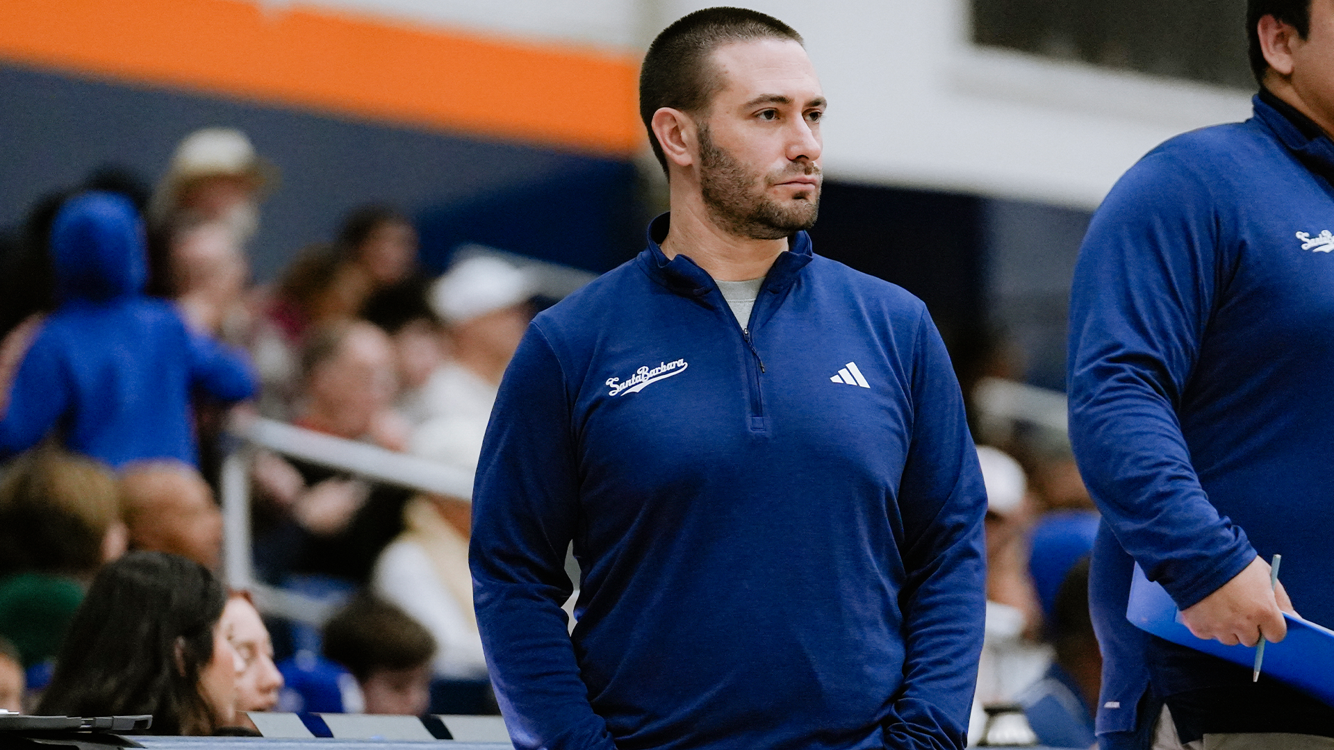 Assistant Coach Brandon Rosenthal stands on the sideline during a time out at Cal State Fullerton.
