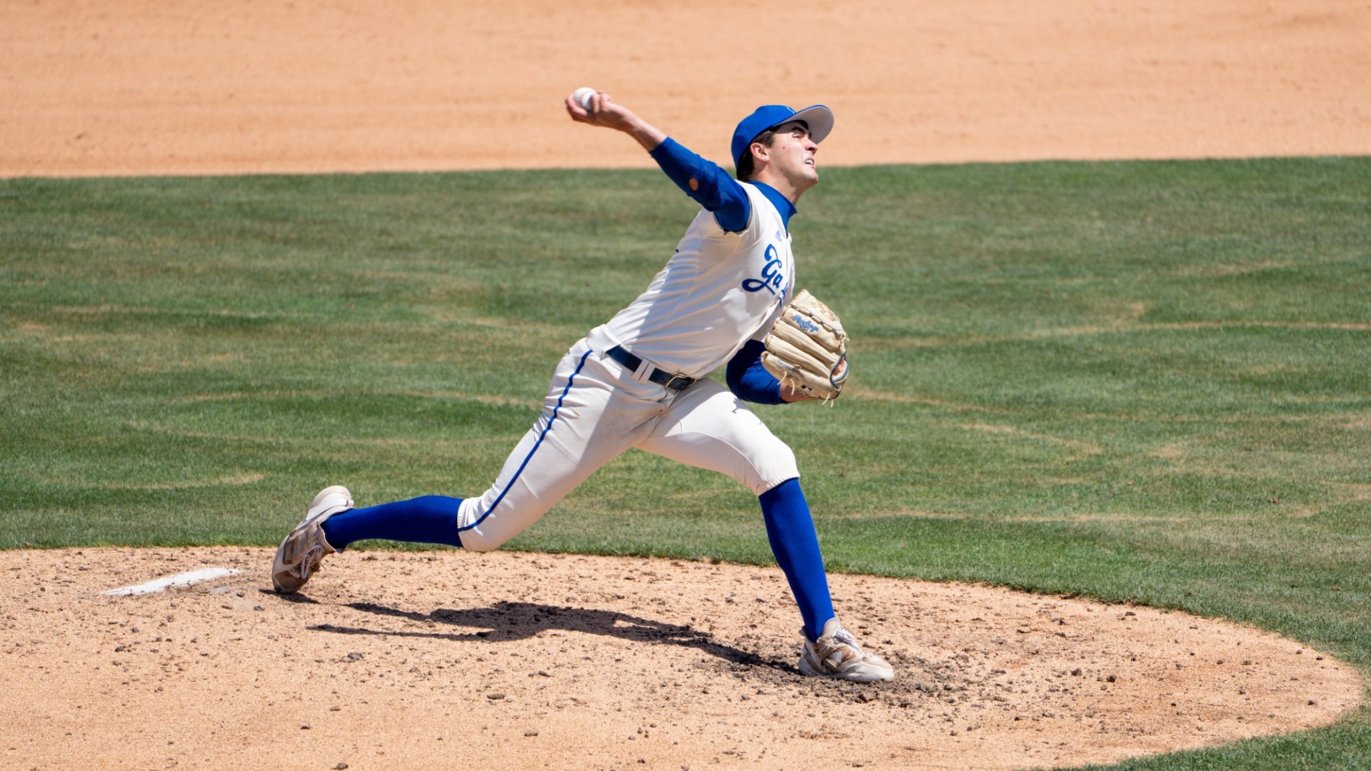 An elevated view from the third-base side of the field as Jackson Flora delivers a pitch at The 2026 Big West Championship tournament in Irvine
