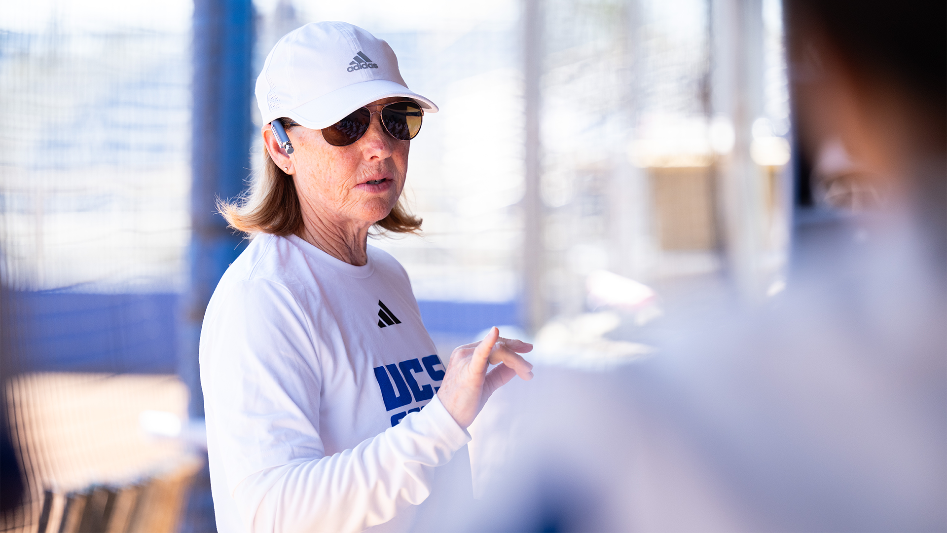 Head Coach Jo Evans stands in front of the team to give them a talk before their game against CSUN