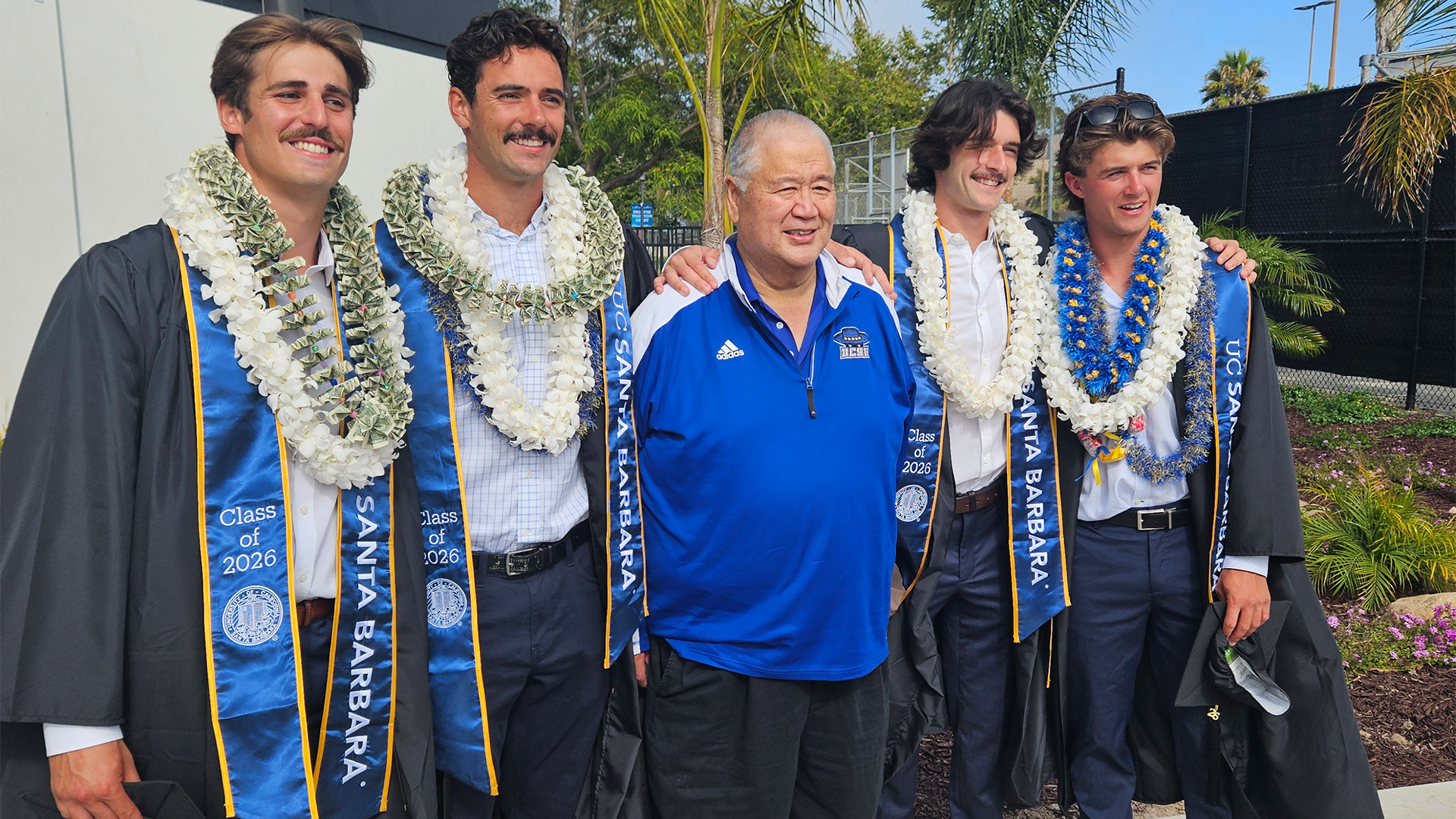 Leroy poses for a picture with four of the Gaucho men's volleyball players from the 2026 season.