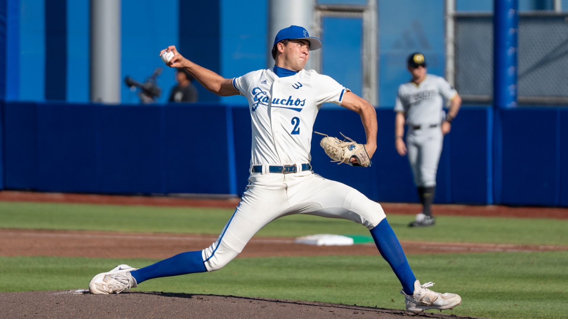 A view from the third-base dugout as Jackson Flora delivers a pitch against Oregon