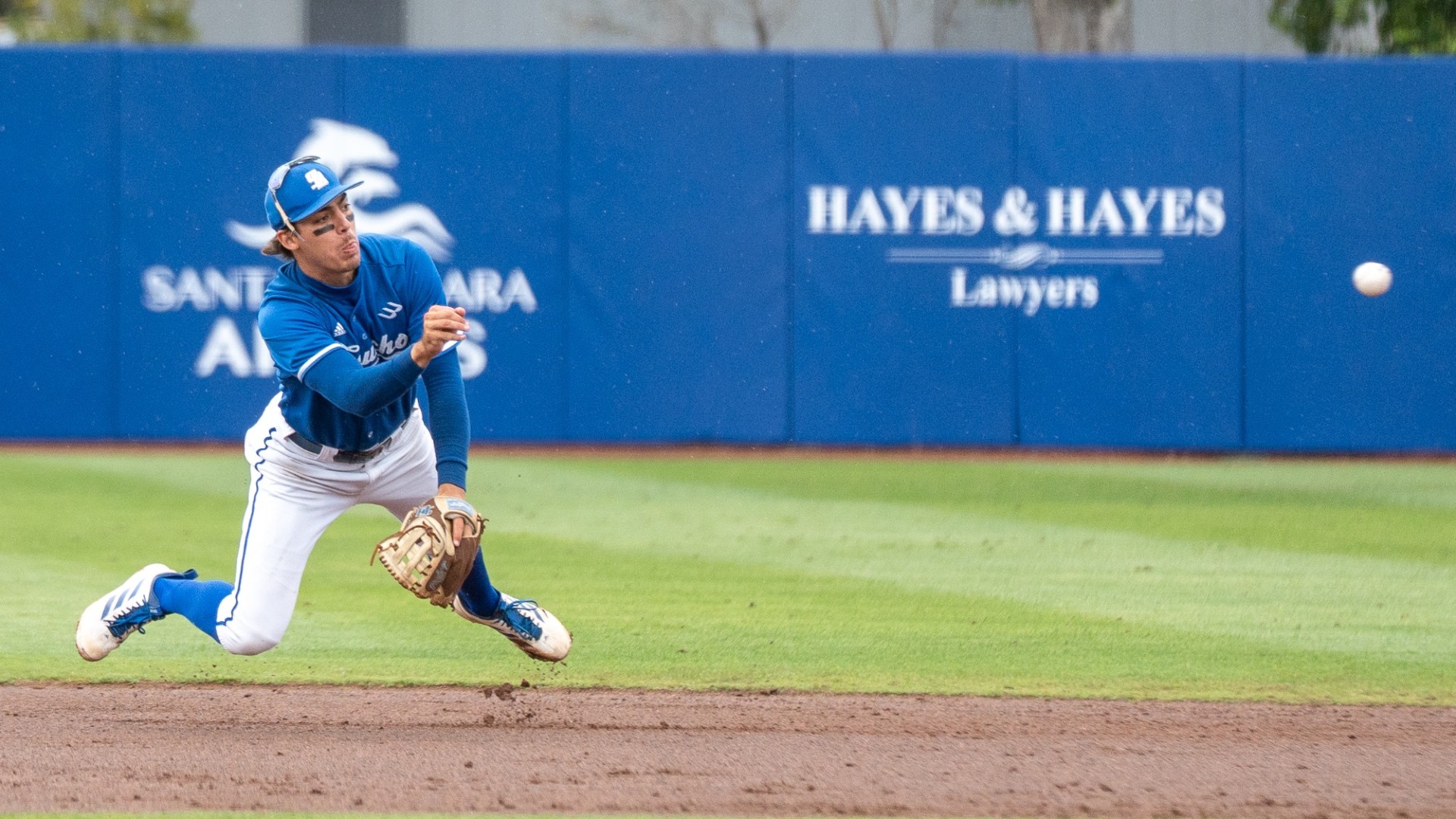 Corey Nunez dives forward and flicks his wrist to make a throw from his shortstop position