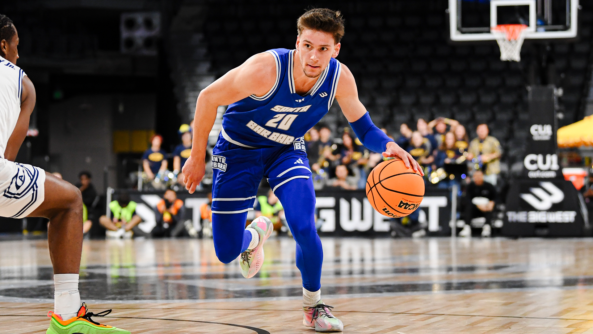Aidan Mahaney drives past a defender at The Big West Championships