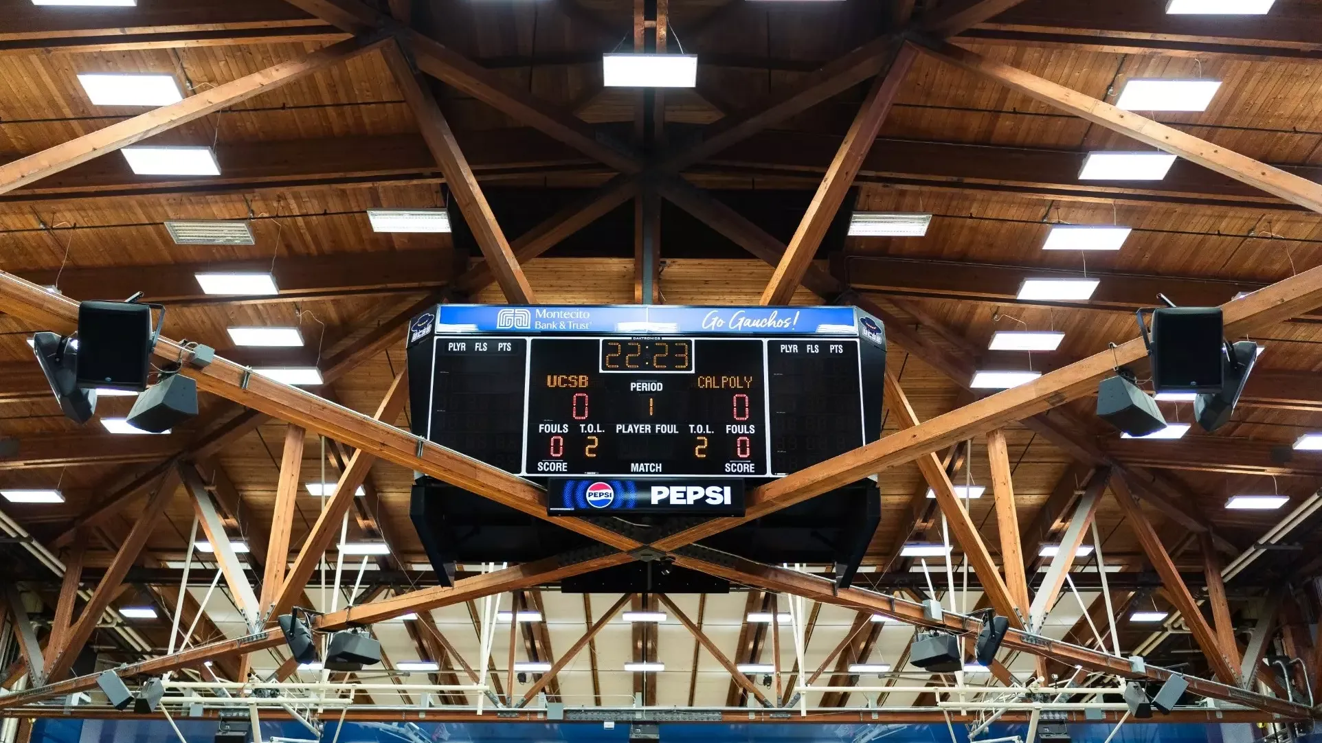 The Thunderdome scoreboard features women's volleyball versus Cal Poly