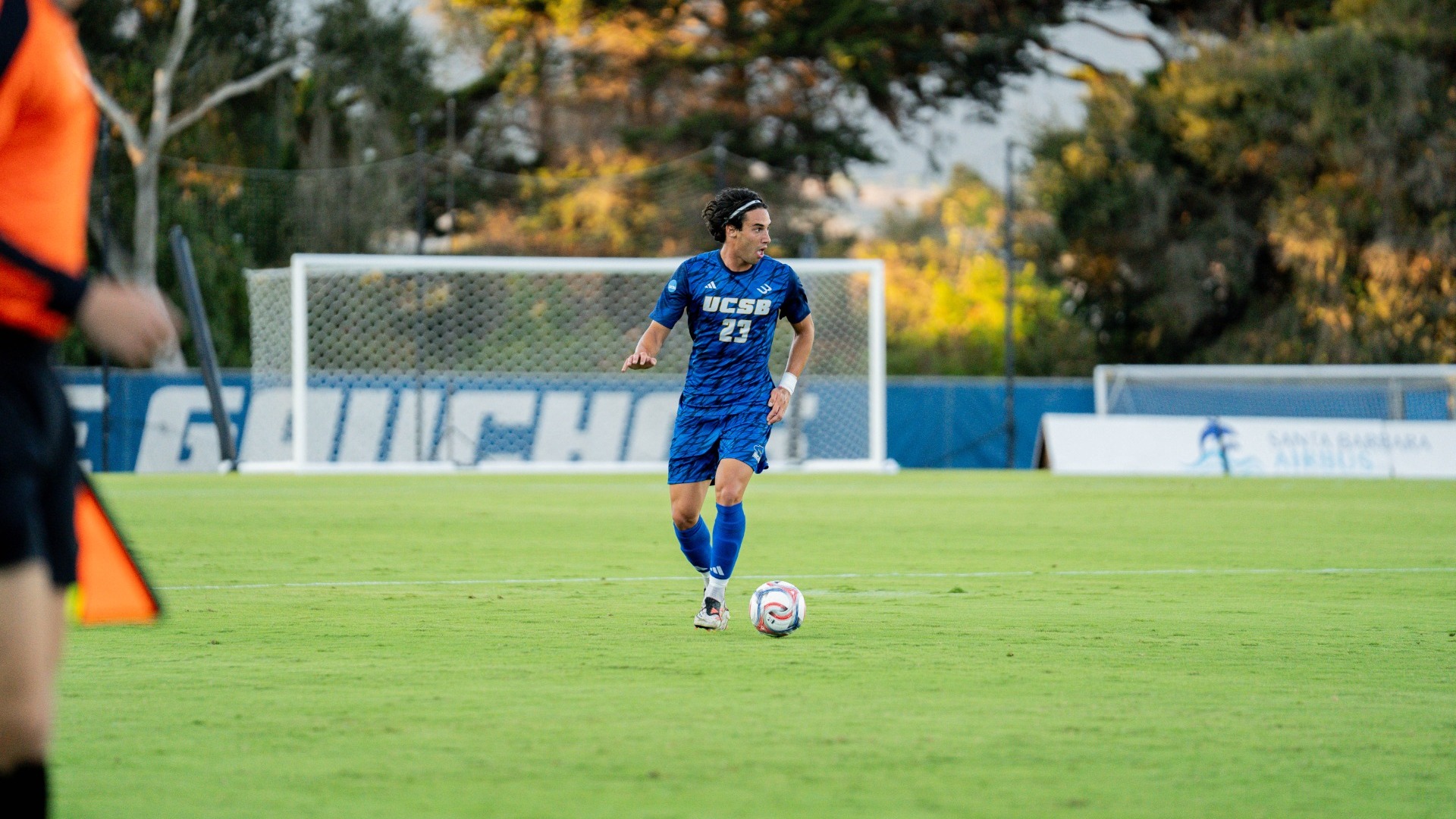 #23 Simone Ferrieri runs into wide open space with the ball at his feet, looking to his left