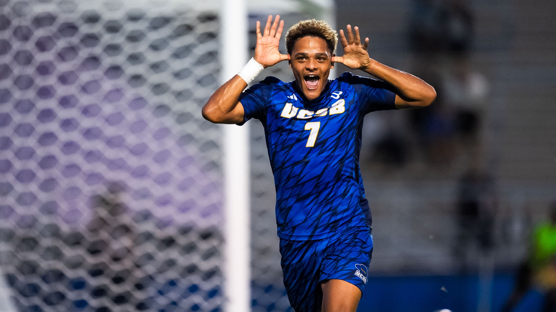 #7 Donovan Sessoms celebrates a goal by holding his hands to either side of his head like antlers