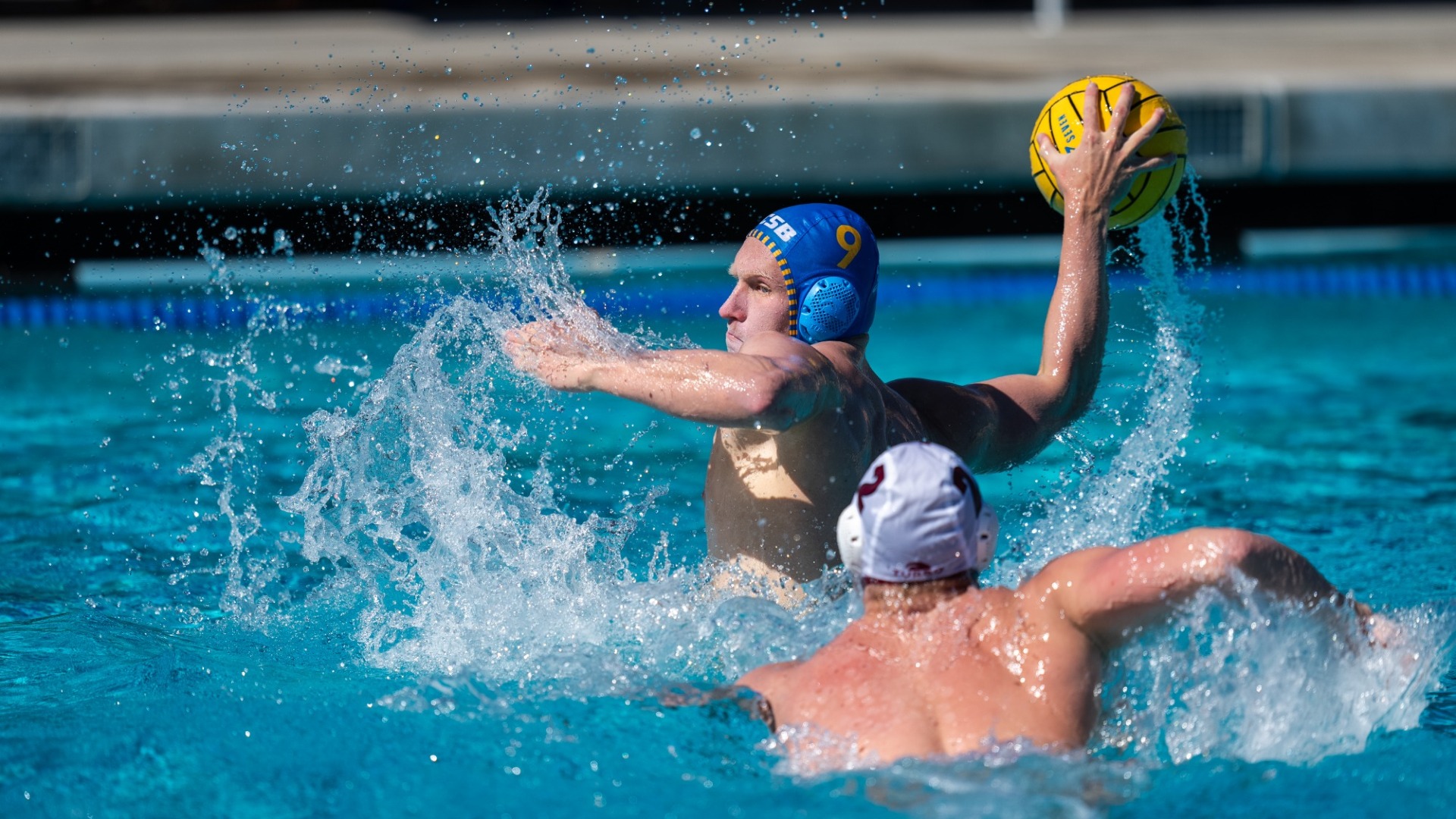 #9 Finn Genc winds up to shoot the ball as a defender closes down on him