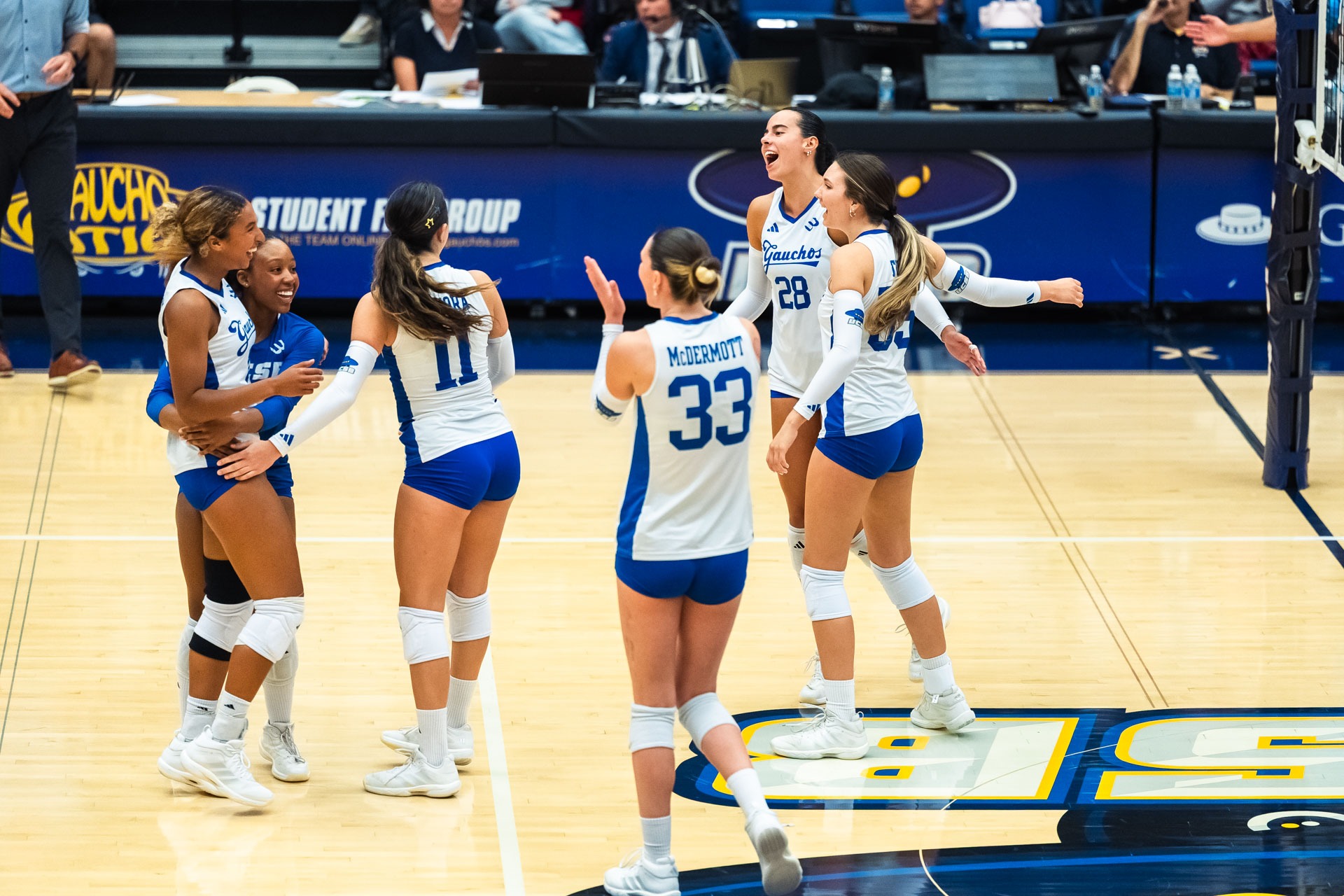 Women's Volleyball celebrates point.