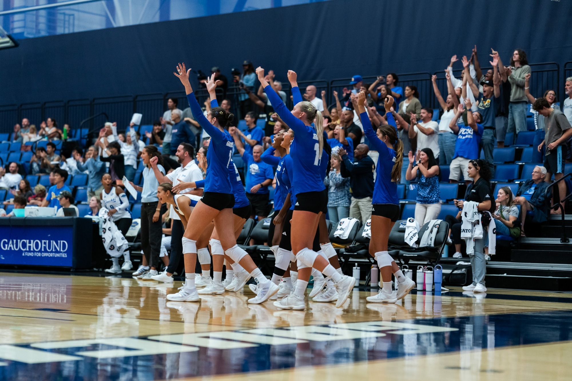 The Gaucho Women's Bench celebrates the win 