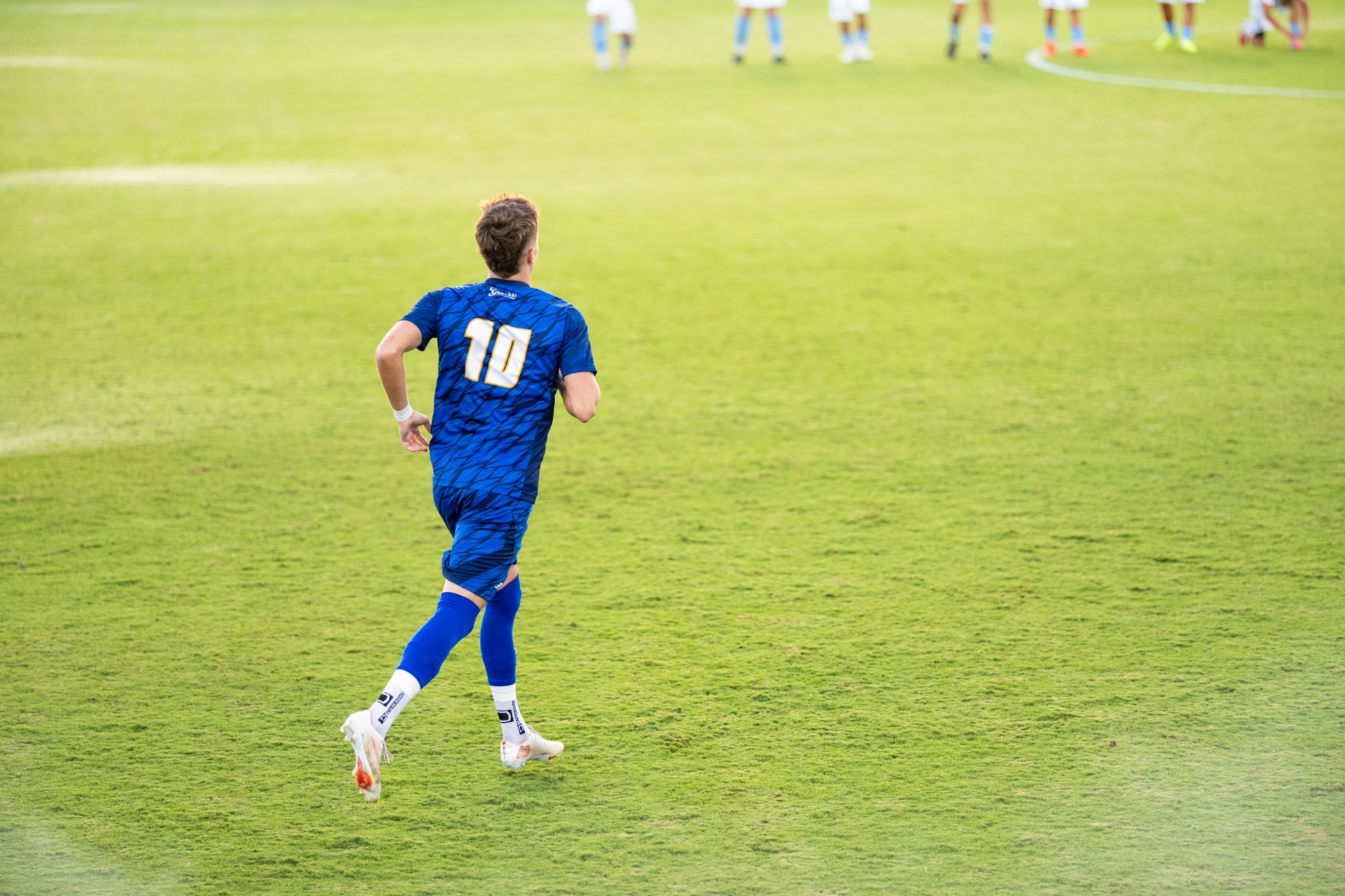 #10 Steinar Bjornsson runs onto the field before a game 
