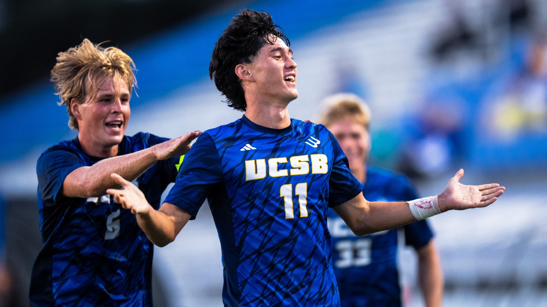 #11 Kaden Standish shrugs, his arms wide, after scoring a goal against San Jose State