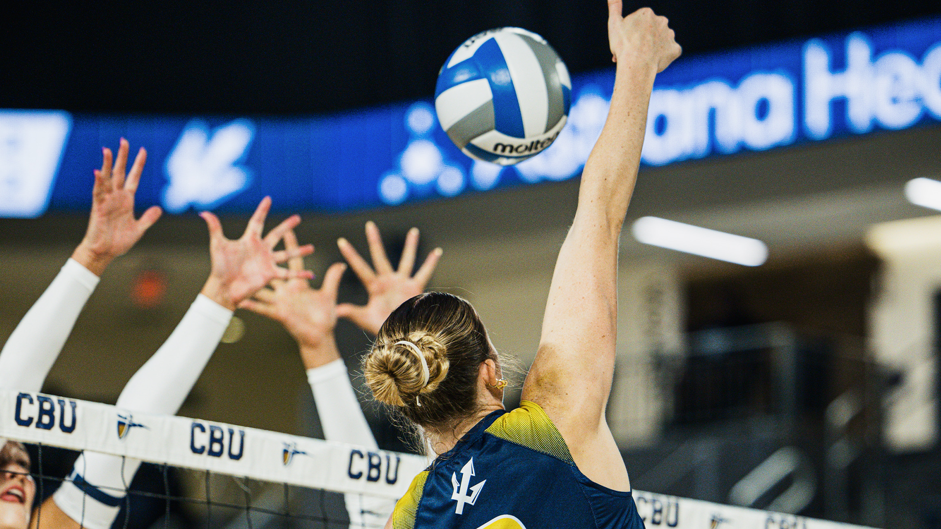 Ireland McNees hits ball over net at CBU