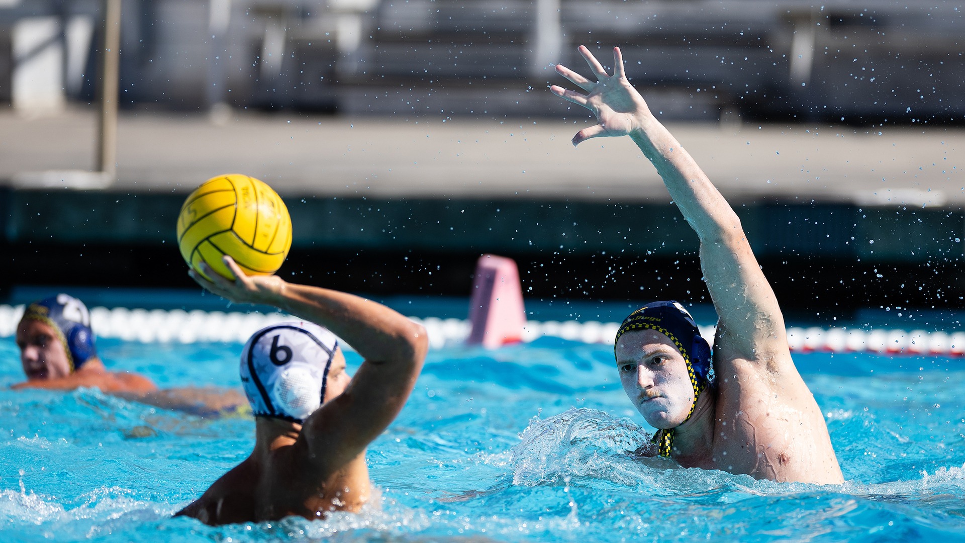 Finn Bugelli with arms up defending an opposing player