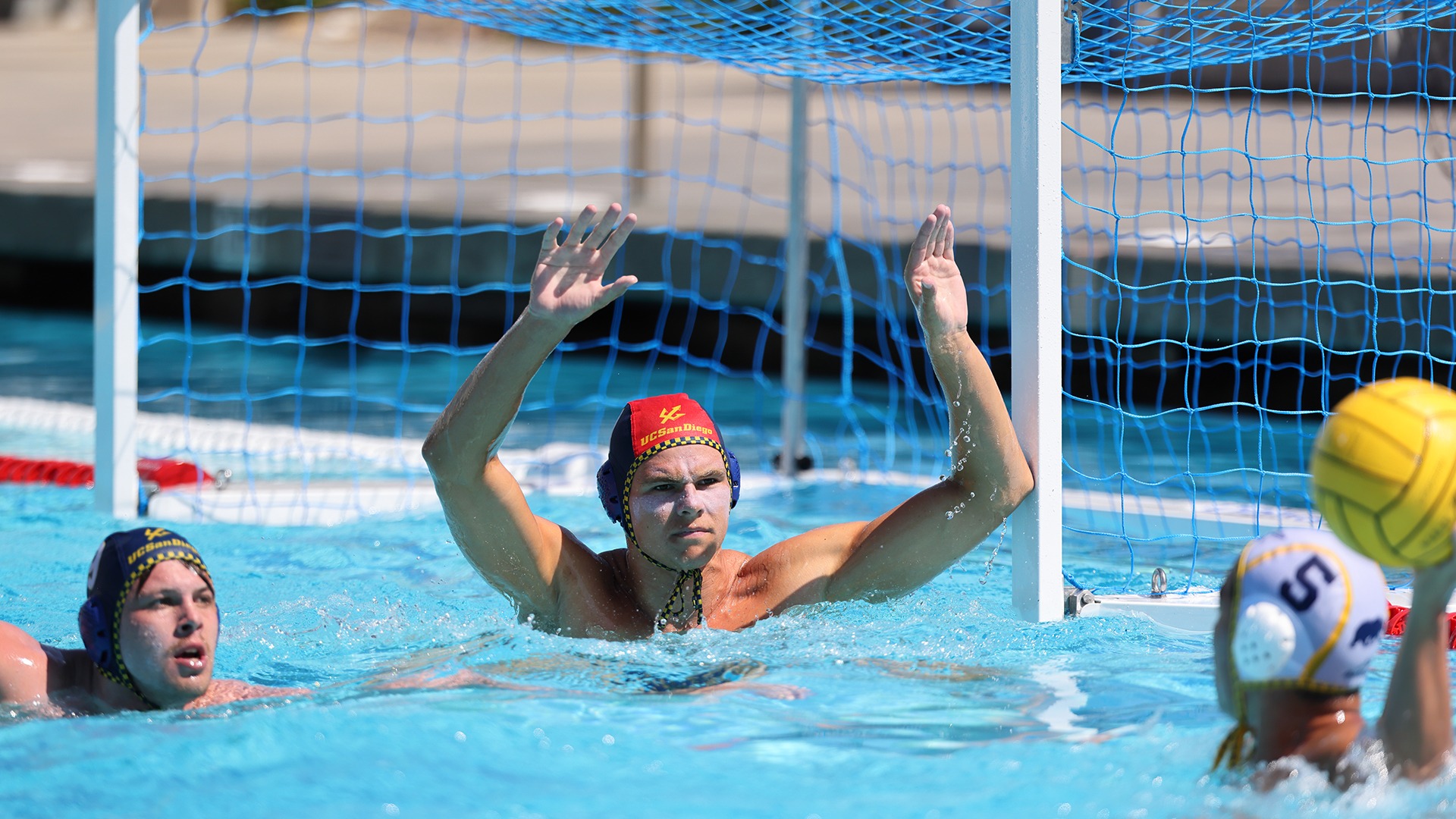 Goalie Alex Hegeman with arms up looking for the save