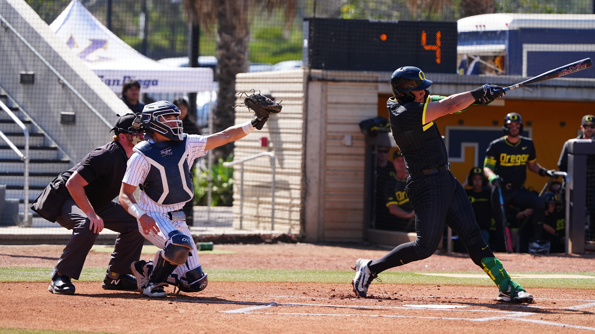 Cal Elvis catching + Oregon batter
