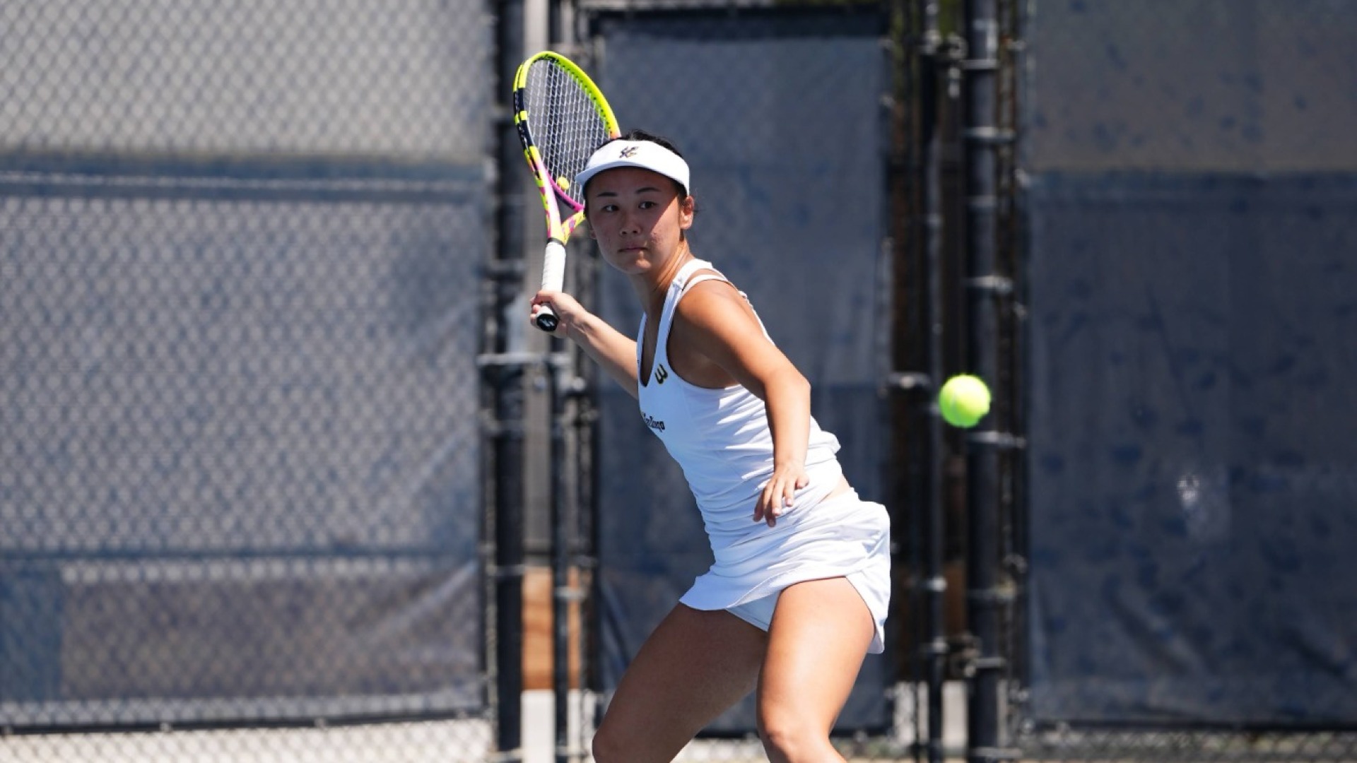 Allison Lian prepares to return a tennis ball with a forehand shot
