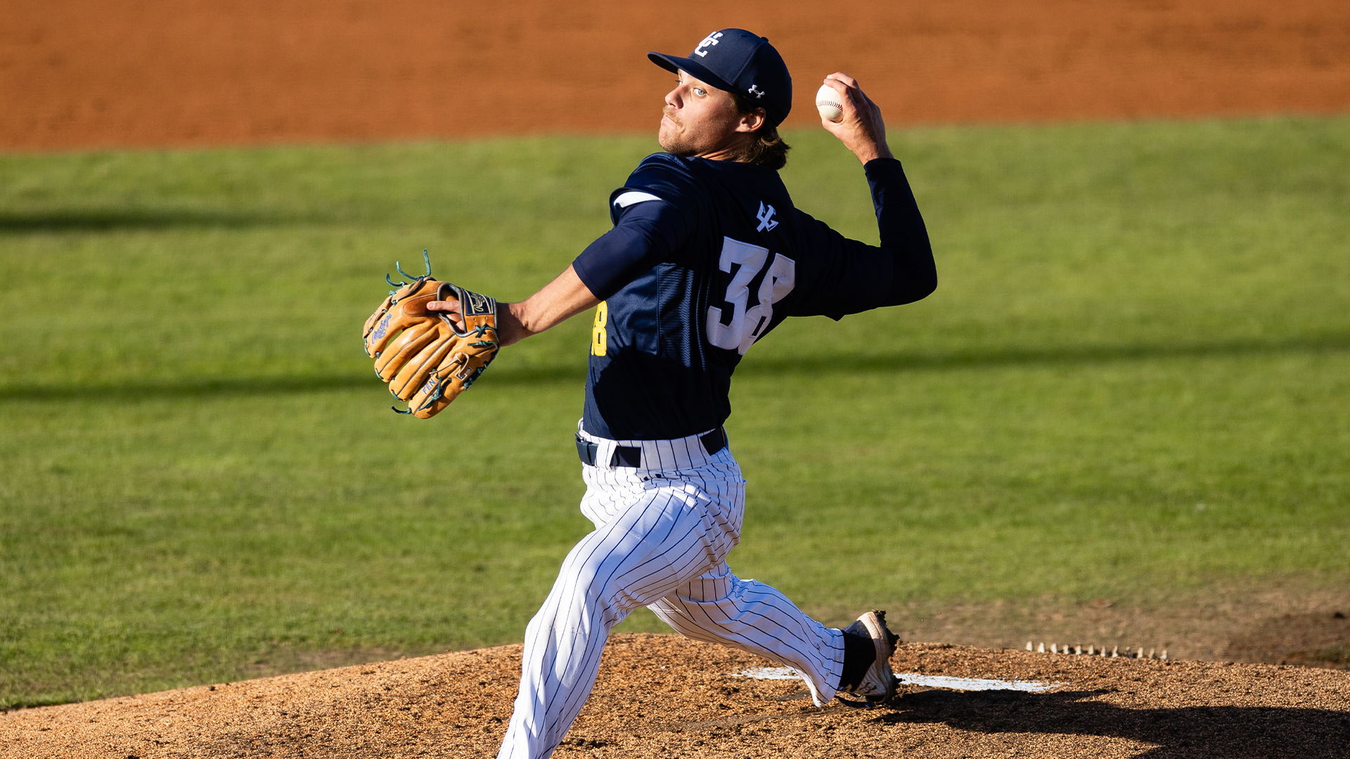 Nic Gregson pitches from the mound