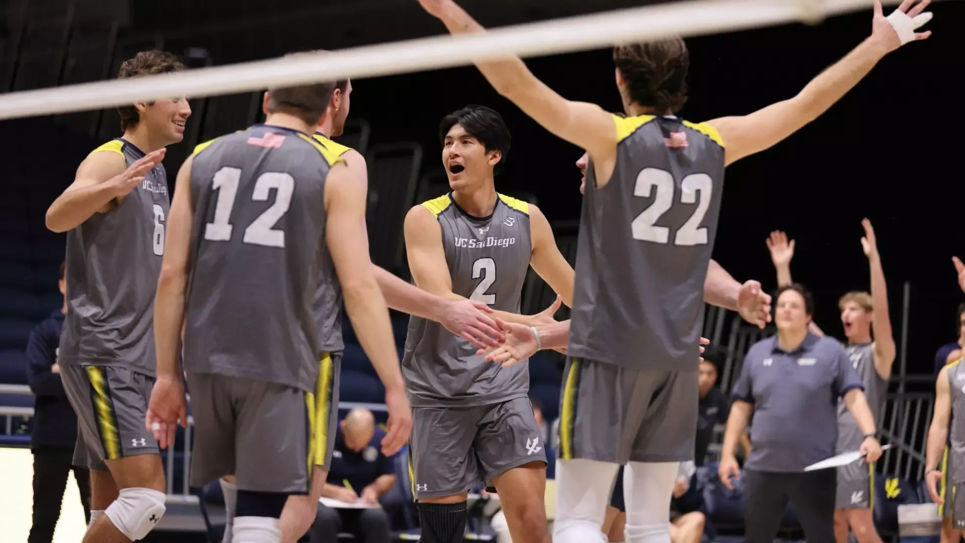 A group of Triton men's volleyball players celebrating