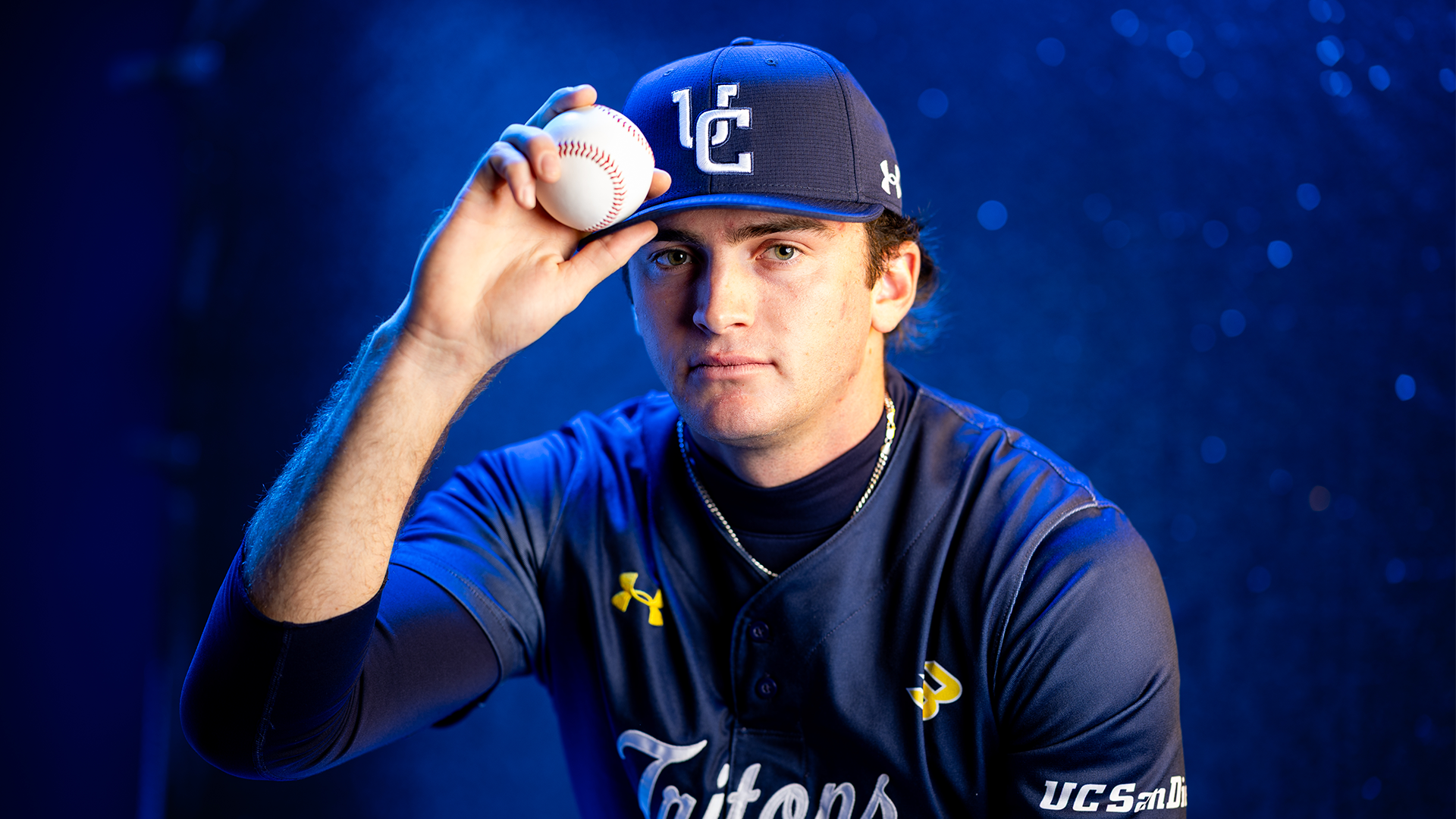 Steele Murdock portrait holding ball and bill of hat