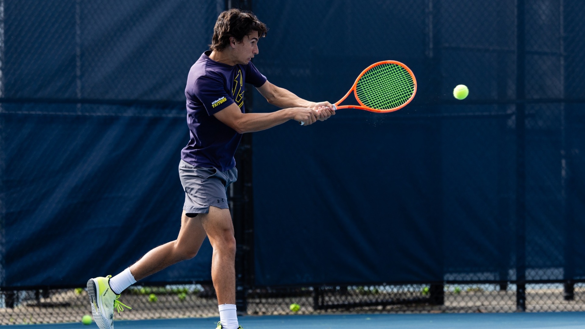 David Adamson hitting a backhand shot on Northview Tennis Courts