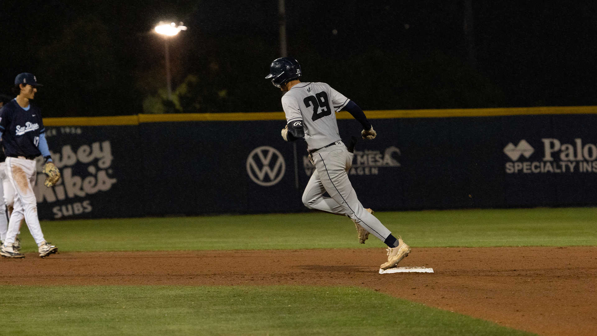 Nathaniel Widelski touches second base after hitting a home run