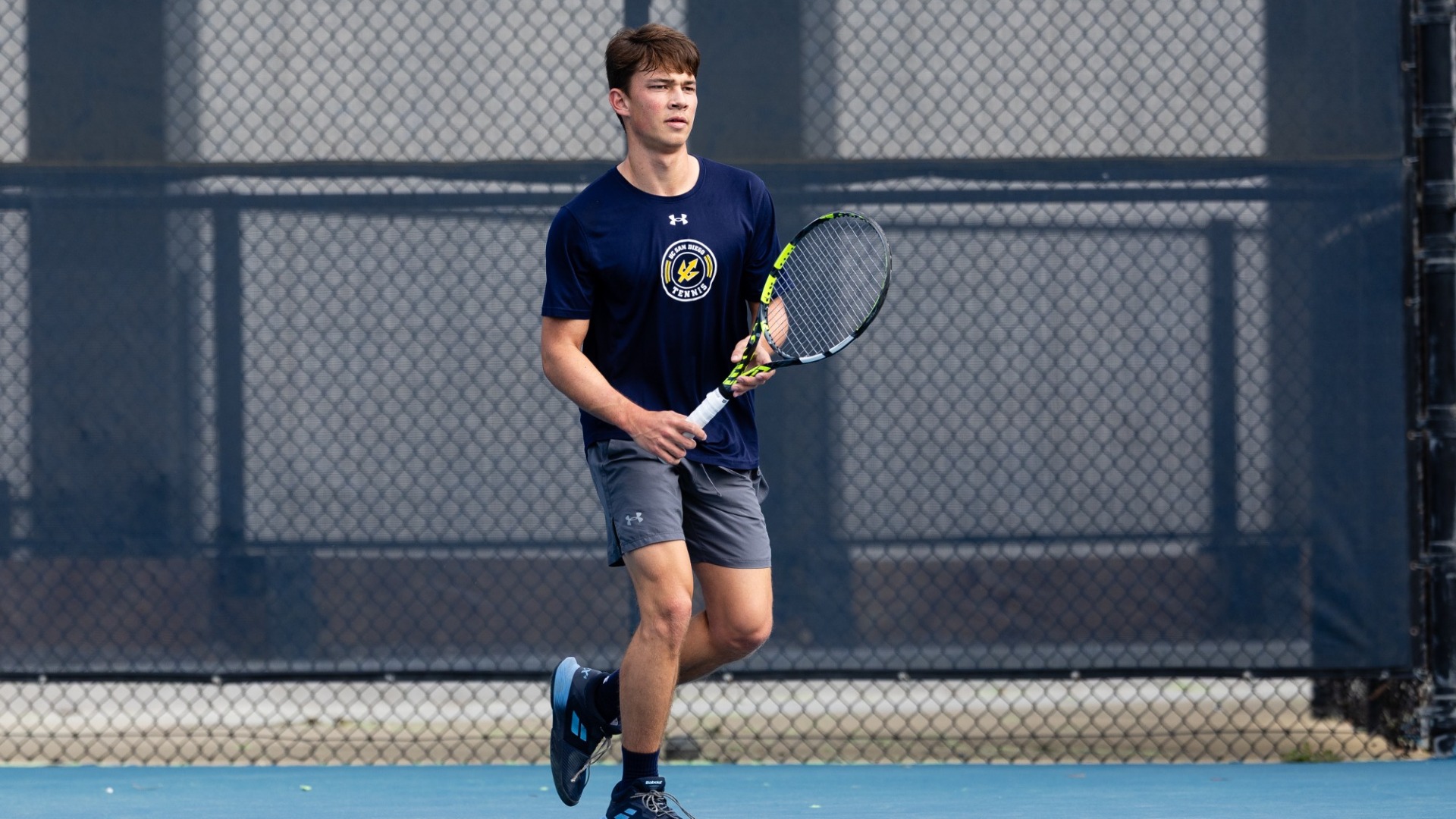 Andrew Beceiro prepares to receive a serve during a UC San Diego tennis match