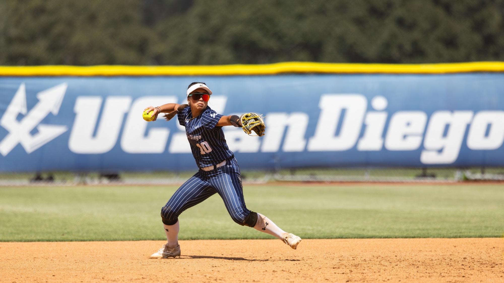 Marley Espiau from UC San Diego Softball throwing 