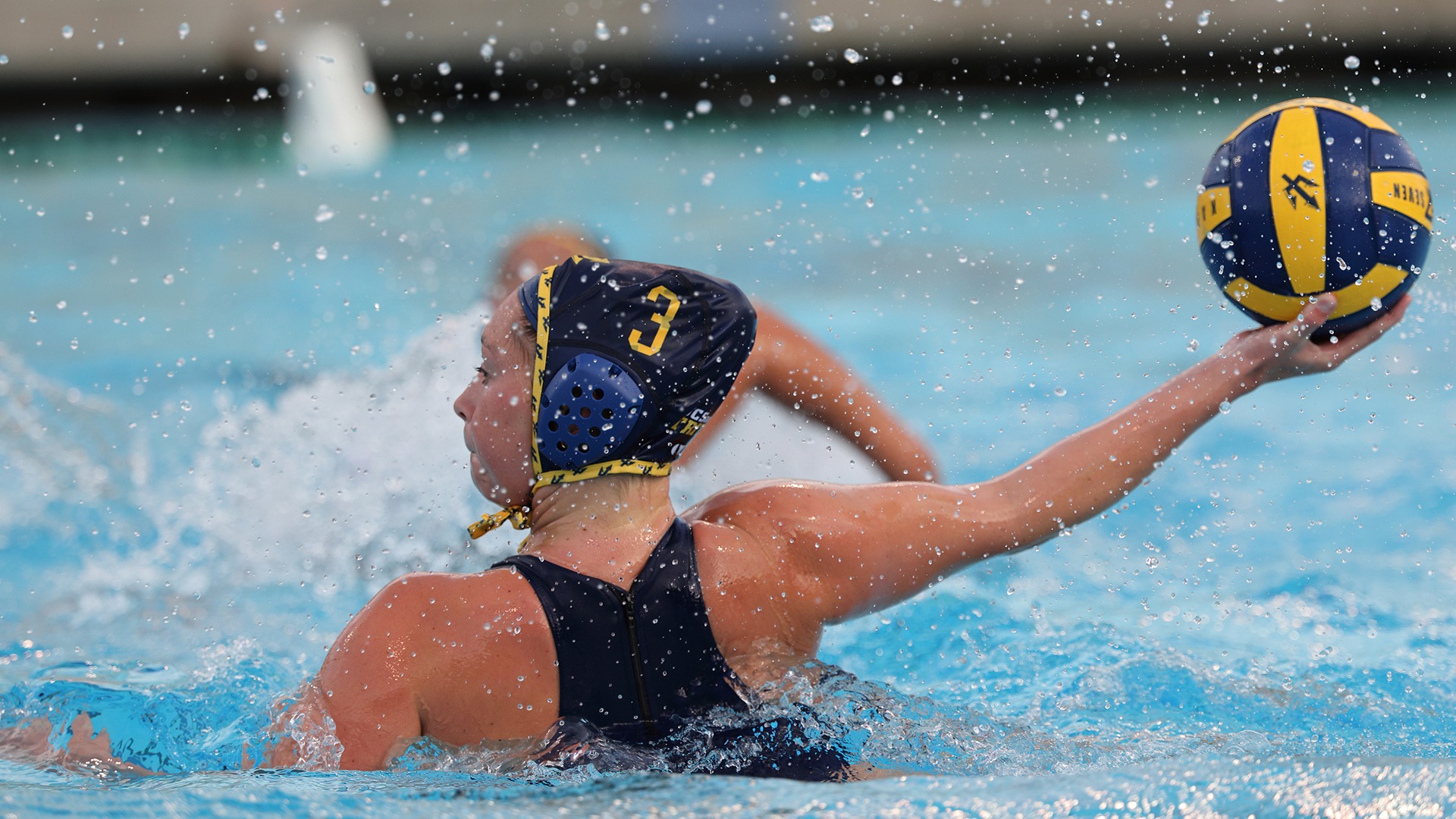 Women's water polo player Emily Cloherty taking a shot