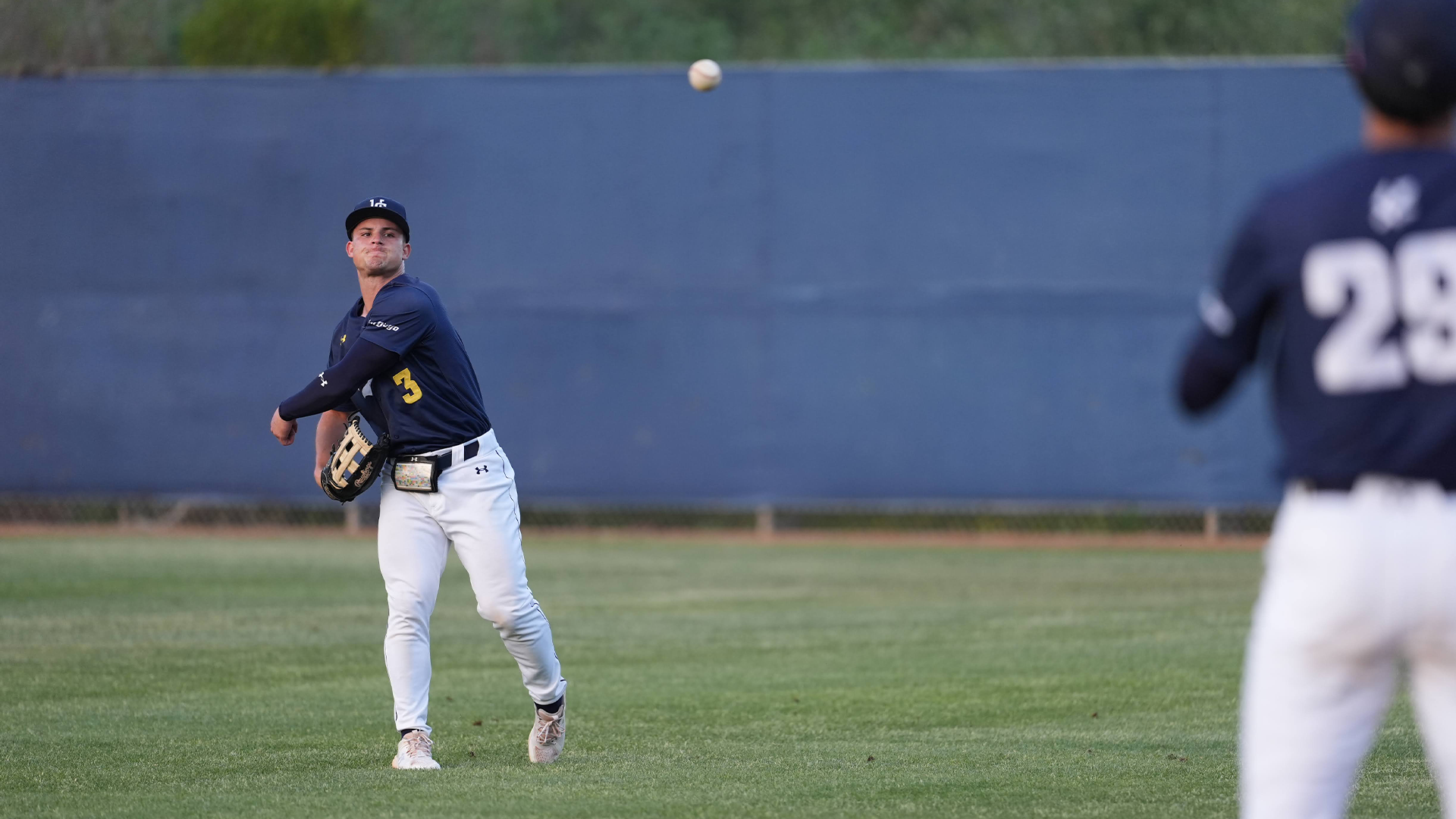 Alex Leopard throws ball from left field