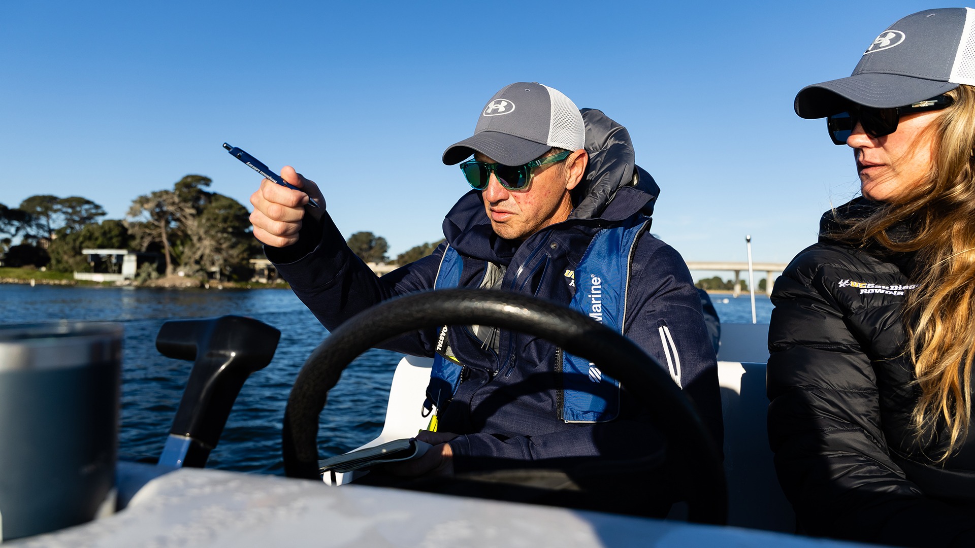 Head coach Colin Truex pilots a launch boat on Mission Bay in San Diego
