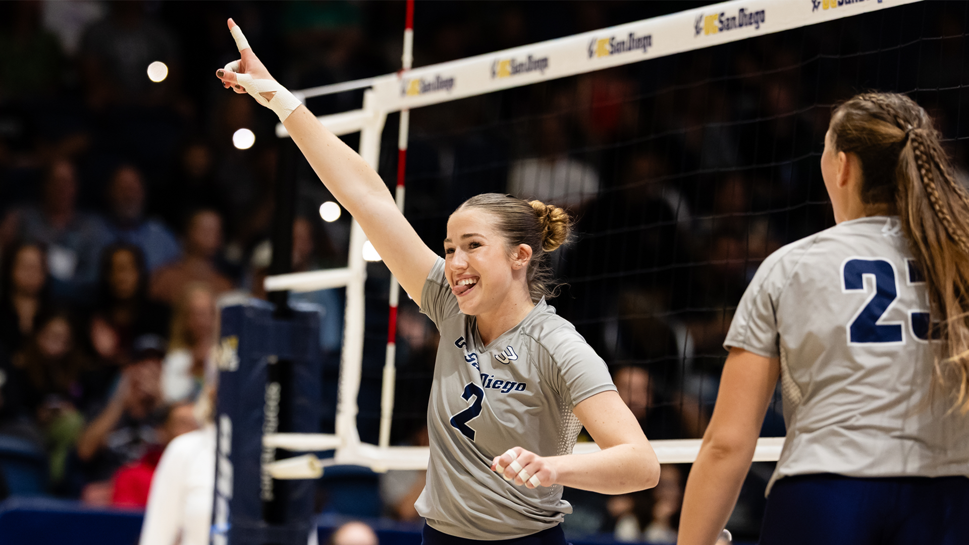 Ireland McNees celebrates with arm raised in air