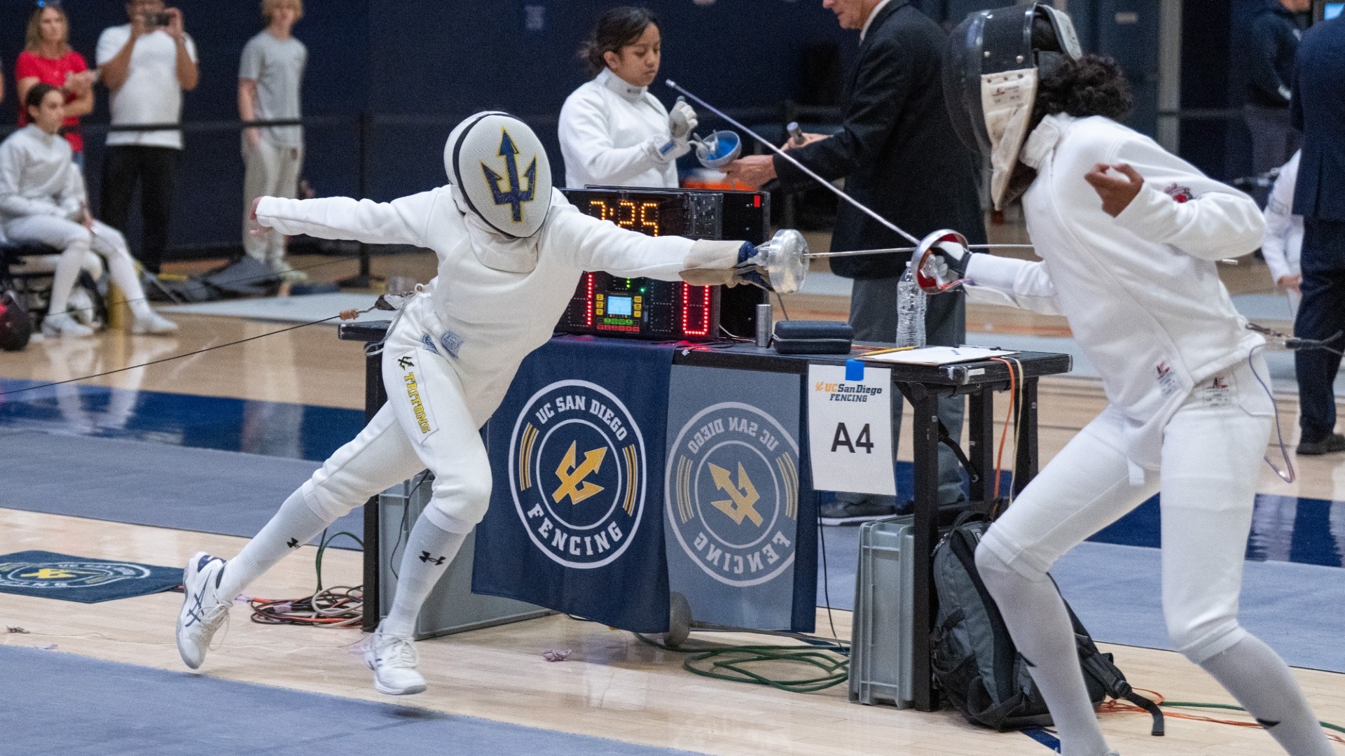 Hania Hafeez lunges at an opponent during an epee bout
