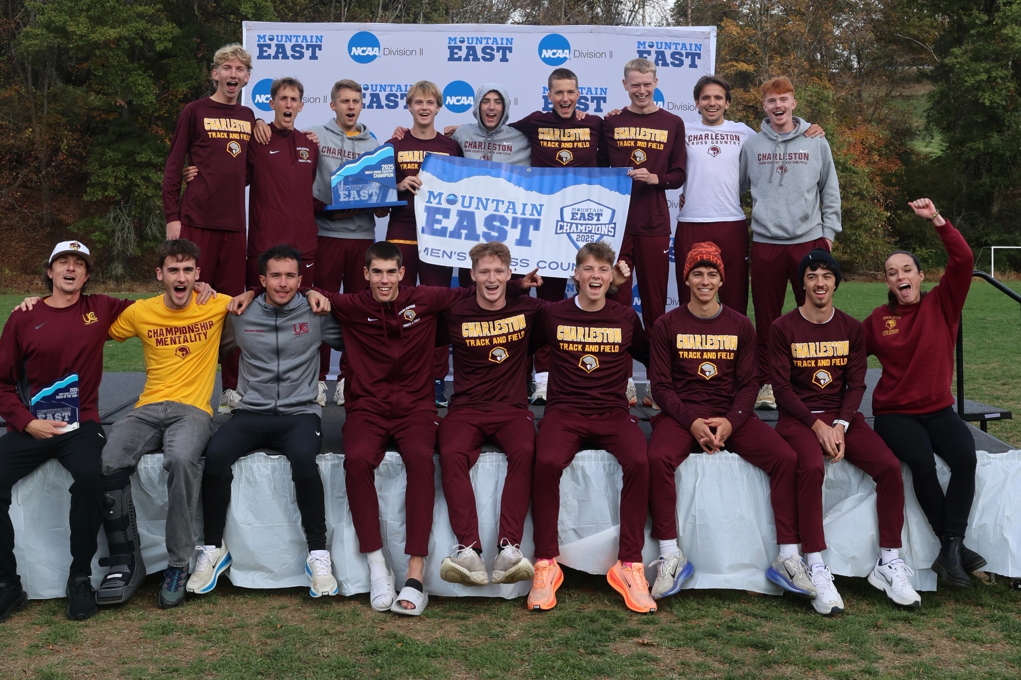 Men's team holding the trophy 